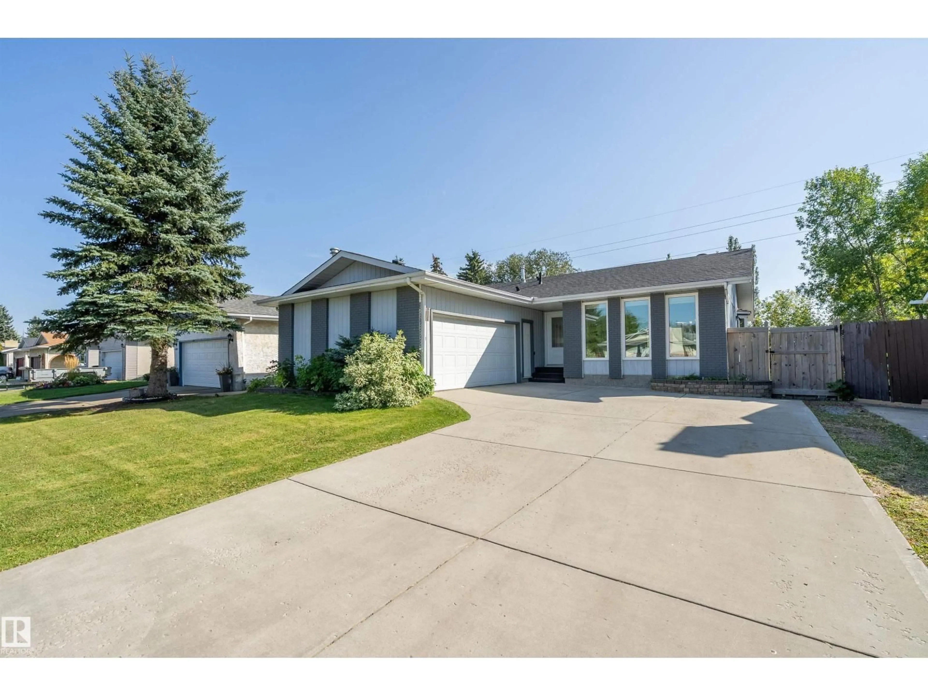 Home with vinyl exterior material, street for 18211 80 AV, Edmonton Alberta T5T0V3