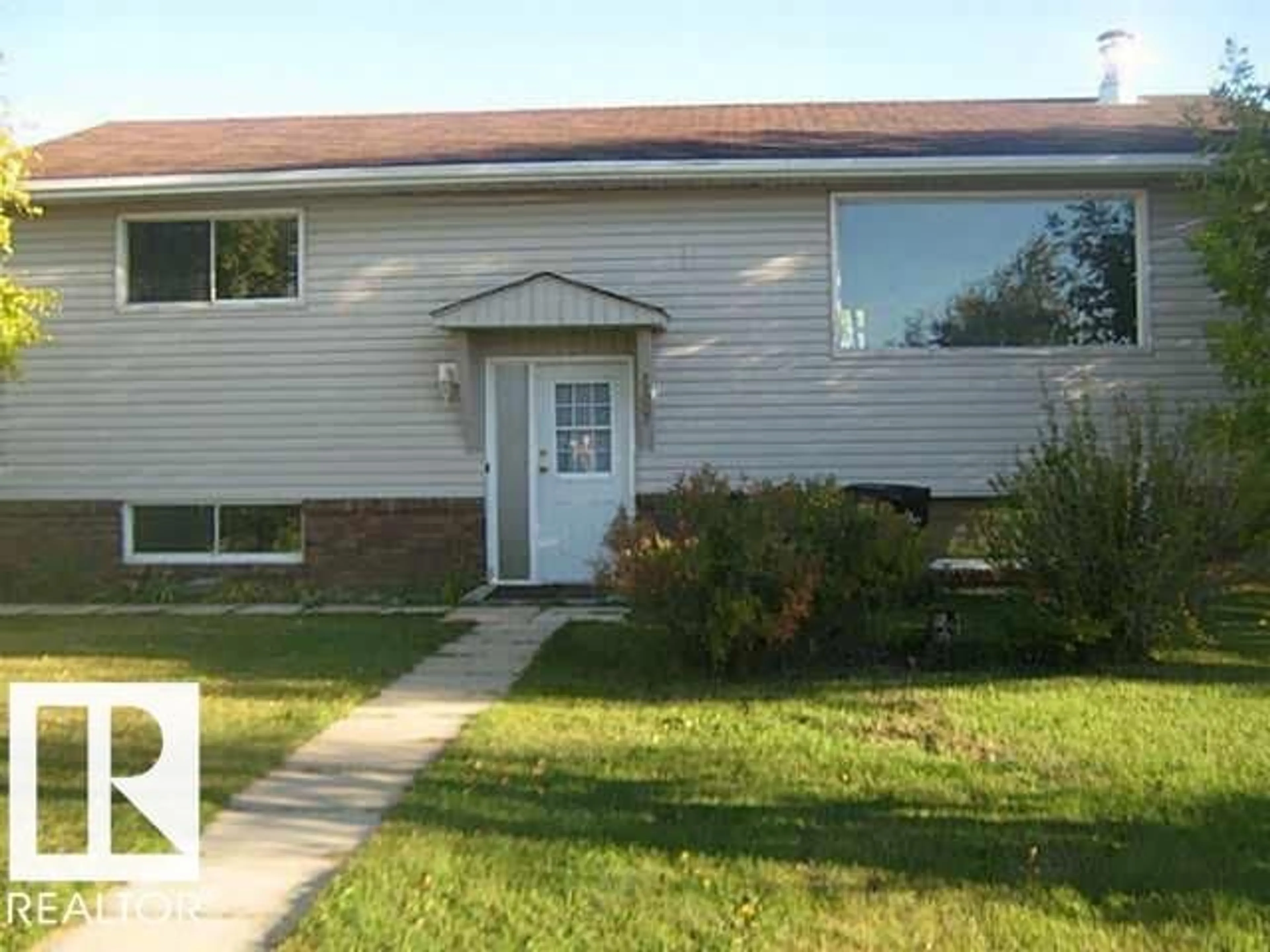 Home with vinyl exterior material, street for 11007 105 ST, Westlock Alberta T7P1E8