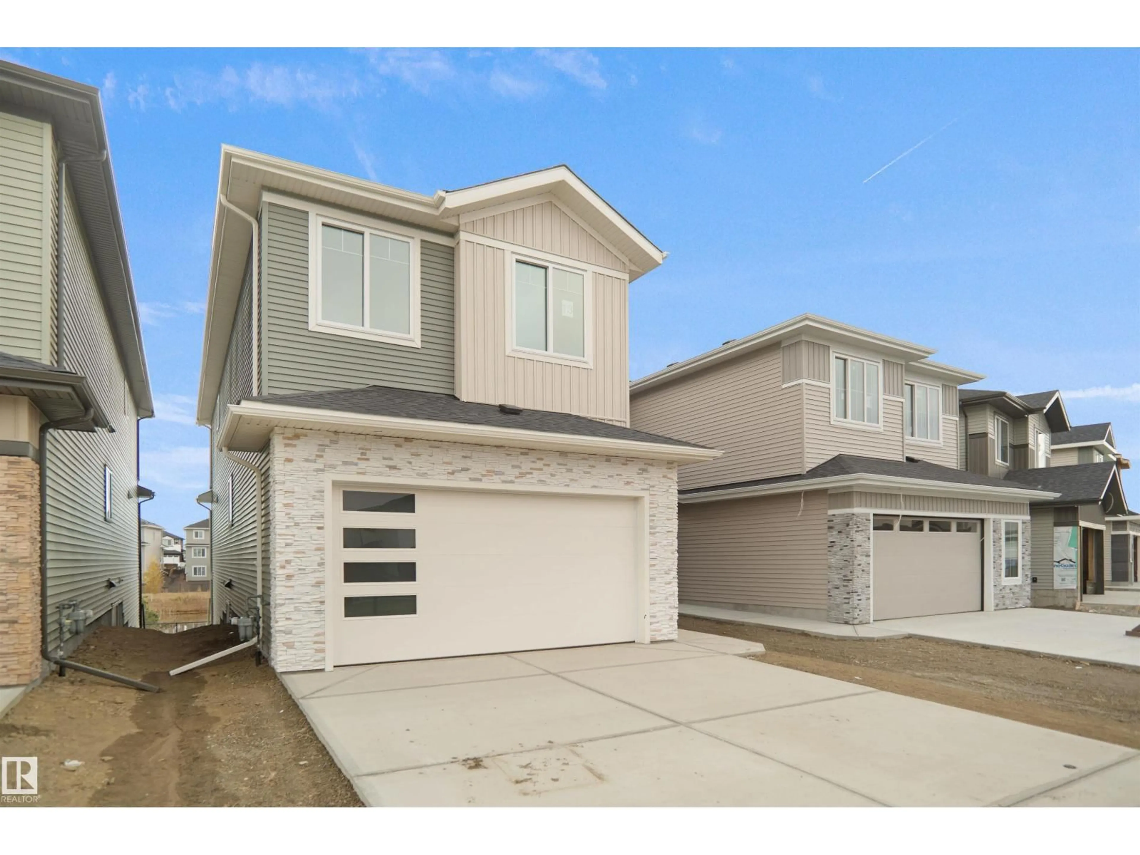 Home with vinyl exterior material, street for 13 AXELWOOD CR, Spruce Grove Alberta T7X4G4