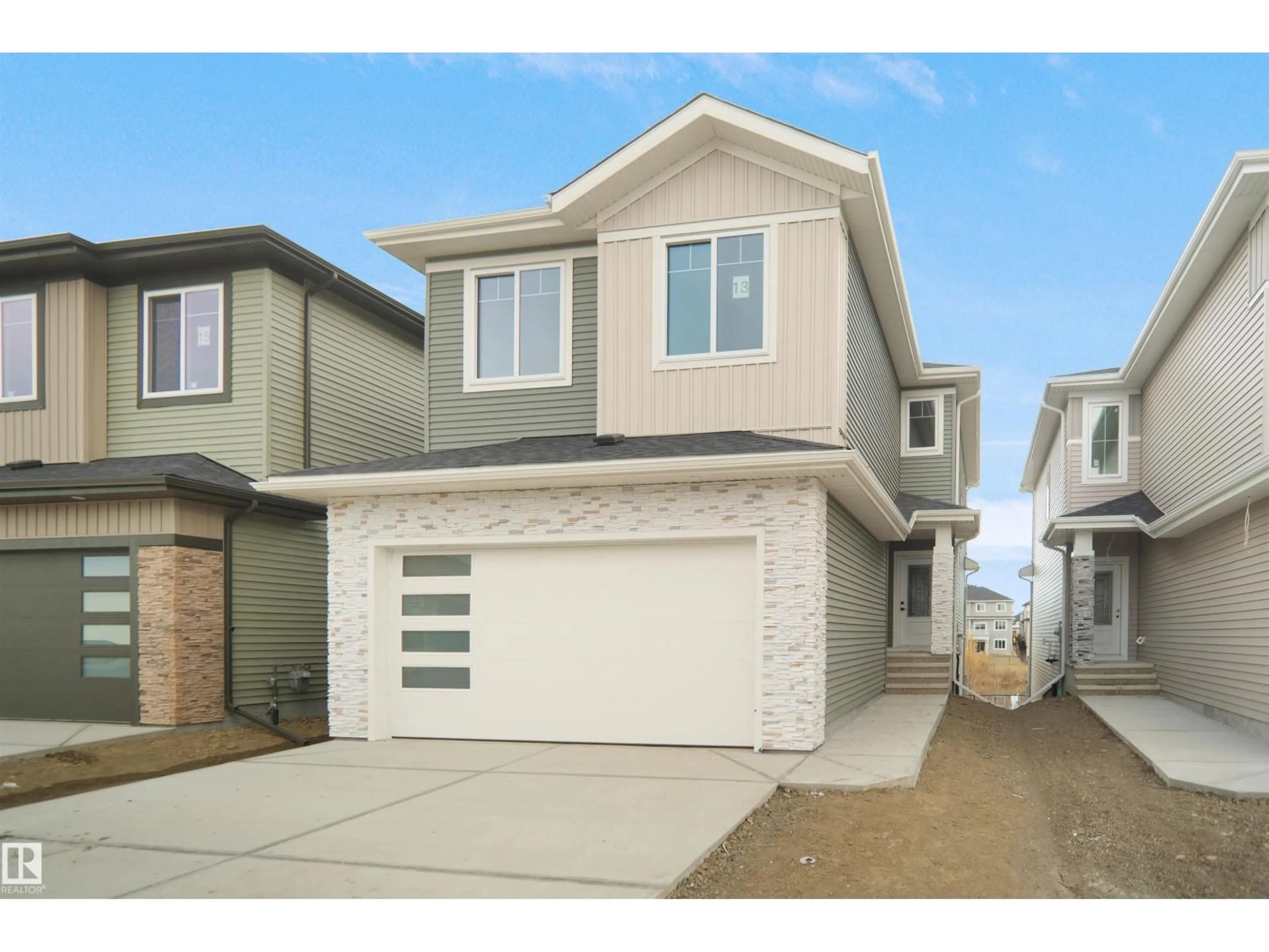 Home with vinyl exterior material, street for 13 AXELWOOD CR, Spruce Grove Alberta T7X4G4