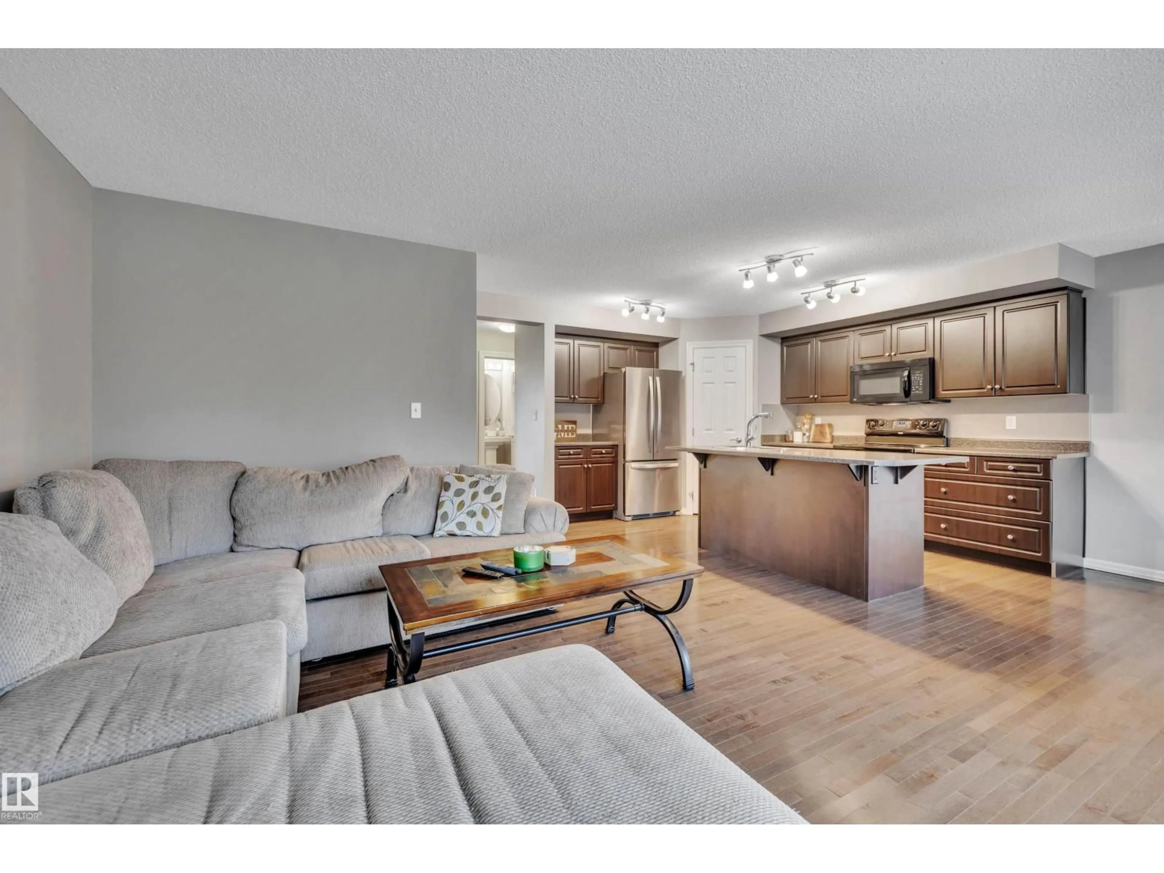 Open concept kitchen, wood/laminate floor for 6213 60 ST, Beaumont Alberta T4X0J3