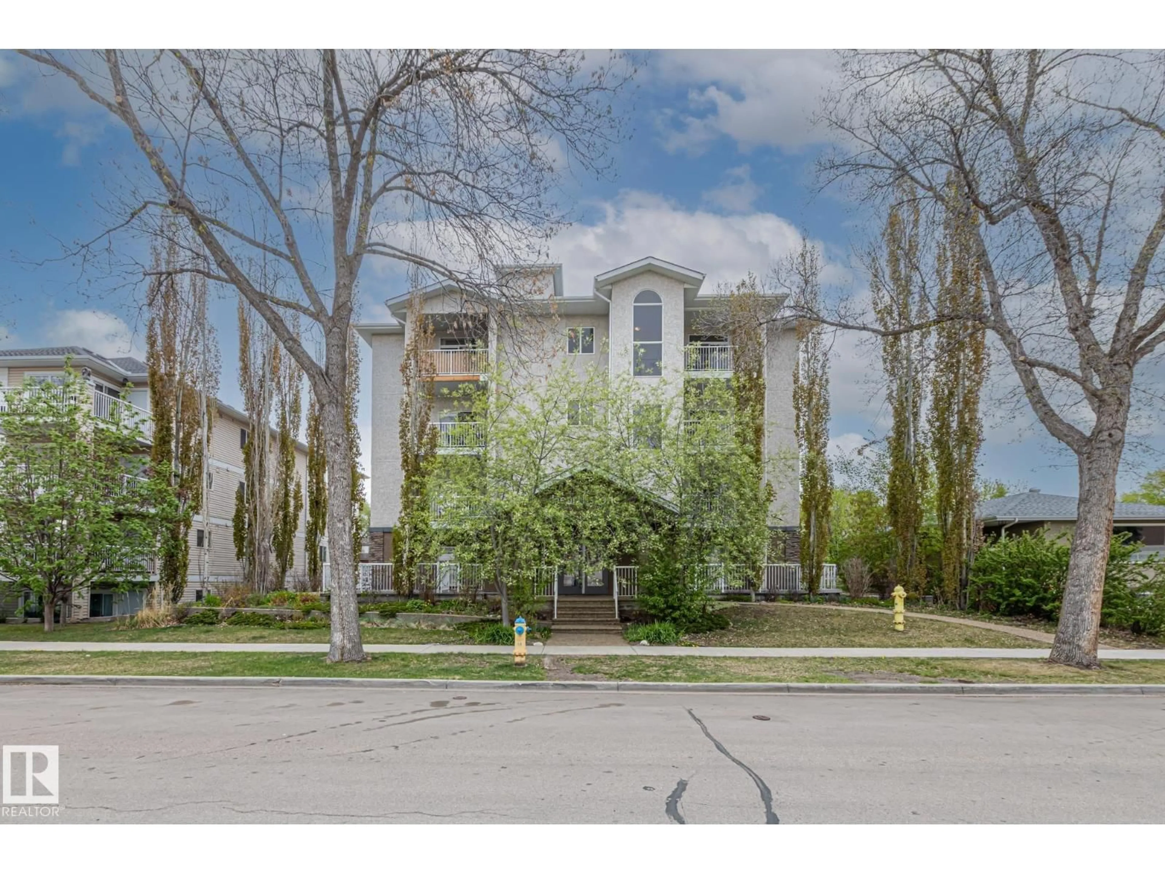 A pic from outside/outdoor area/front of a property/back of a property/a pic from drone, street for #402 - 10524 77 AV, Edmonton Alberta T6E1N1