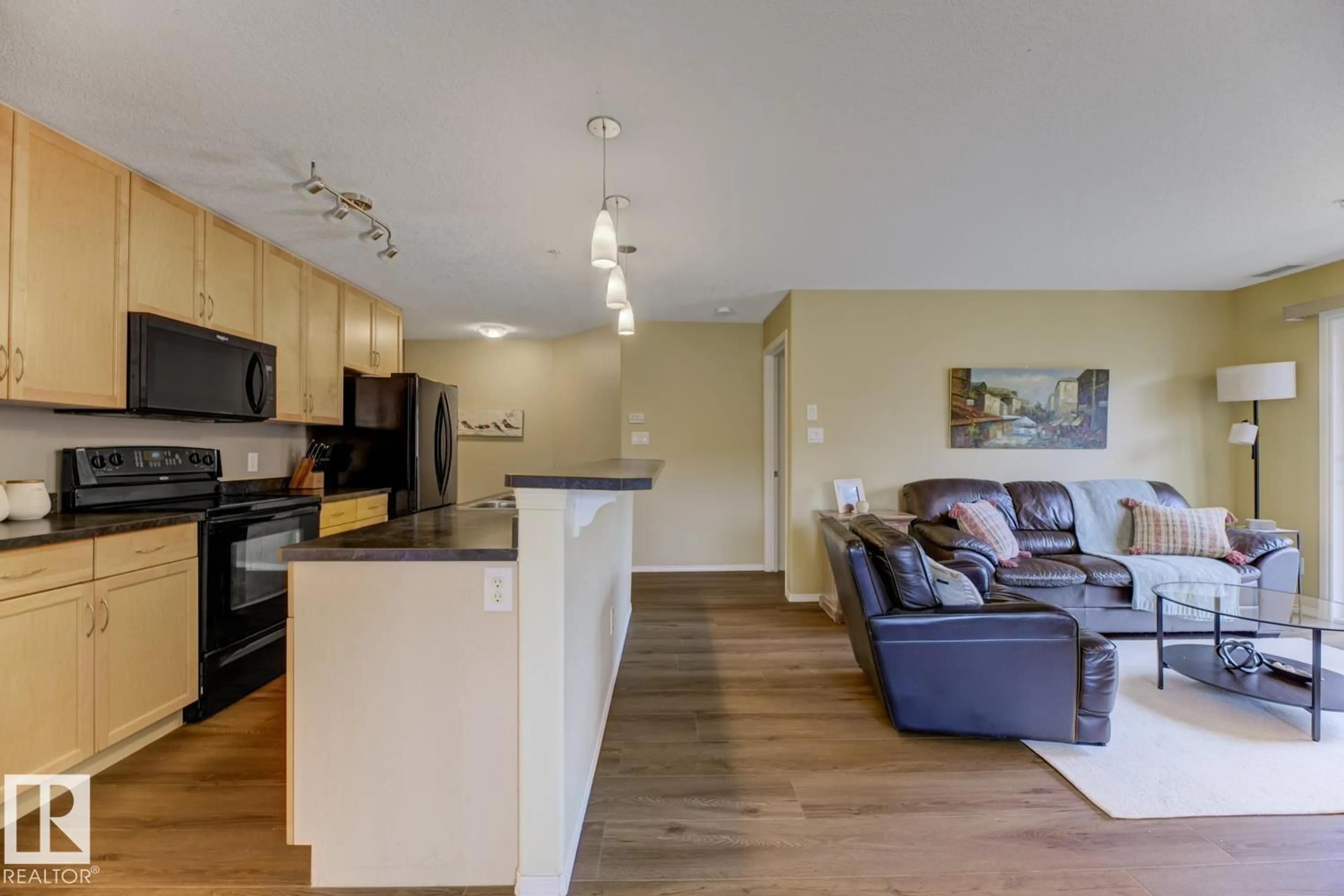 Open concept kitchen, wood/laminate floor for 78B - 233 MCKENNEY AV, St. Albert Alberta T8N1H6