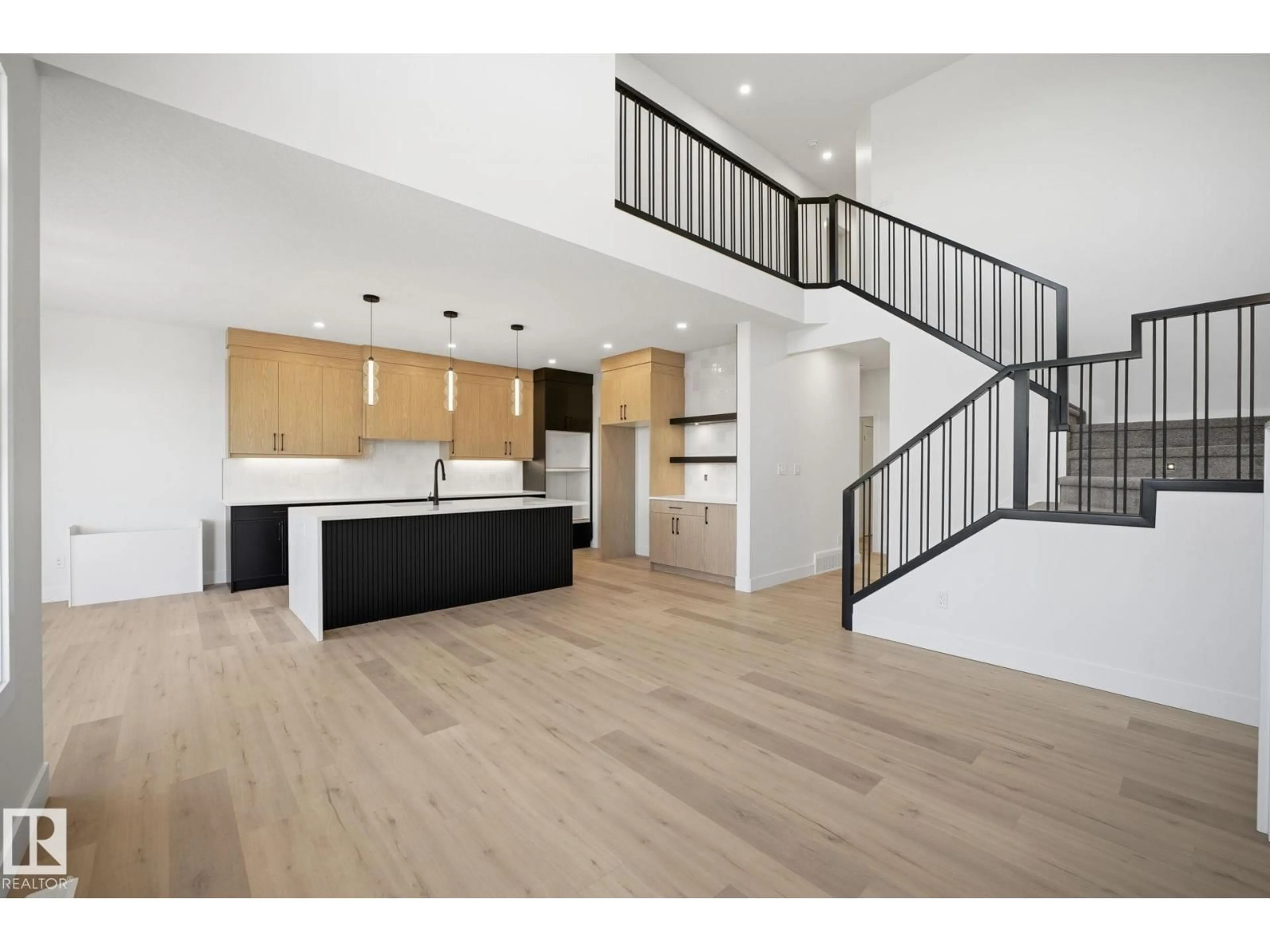 Open concept kitchen, wood/laminate floor for 3317 CHICKADEE DR, Edmonton Alberta T5S0V6