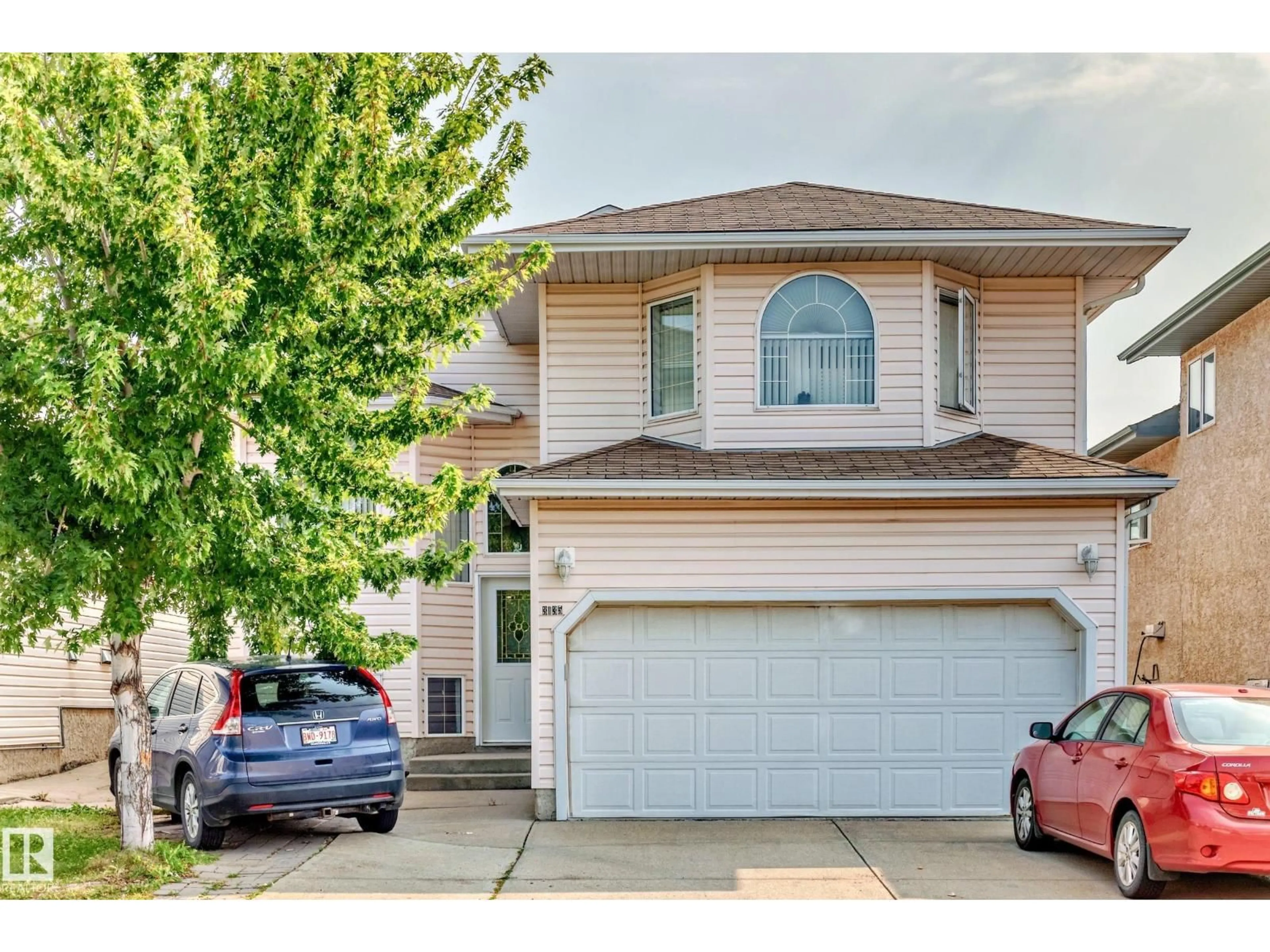 Home with vinyl exterior material, street for NW - 3135 34B AV, Edmonton Alberta T6T1T6