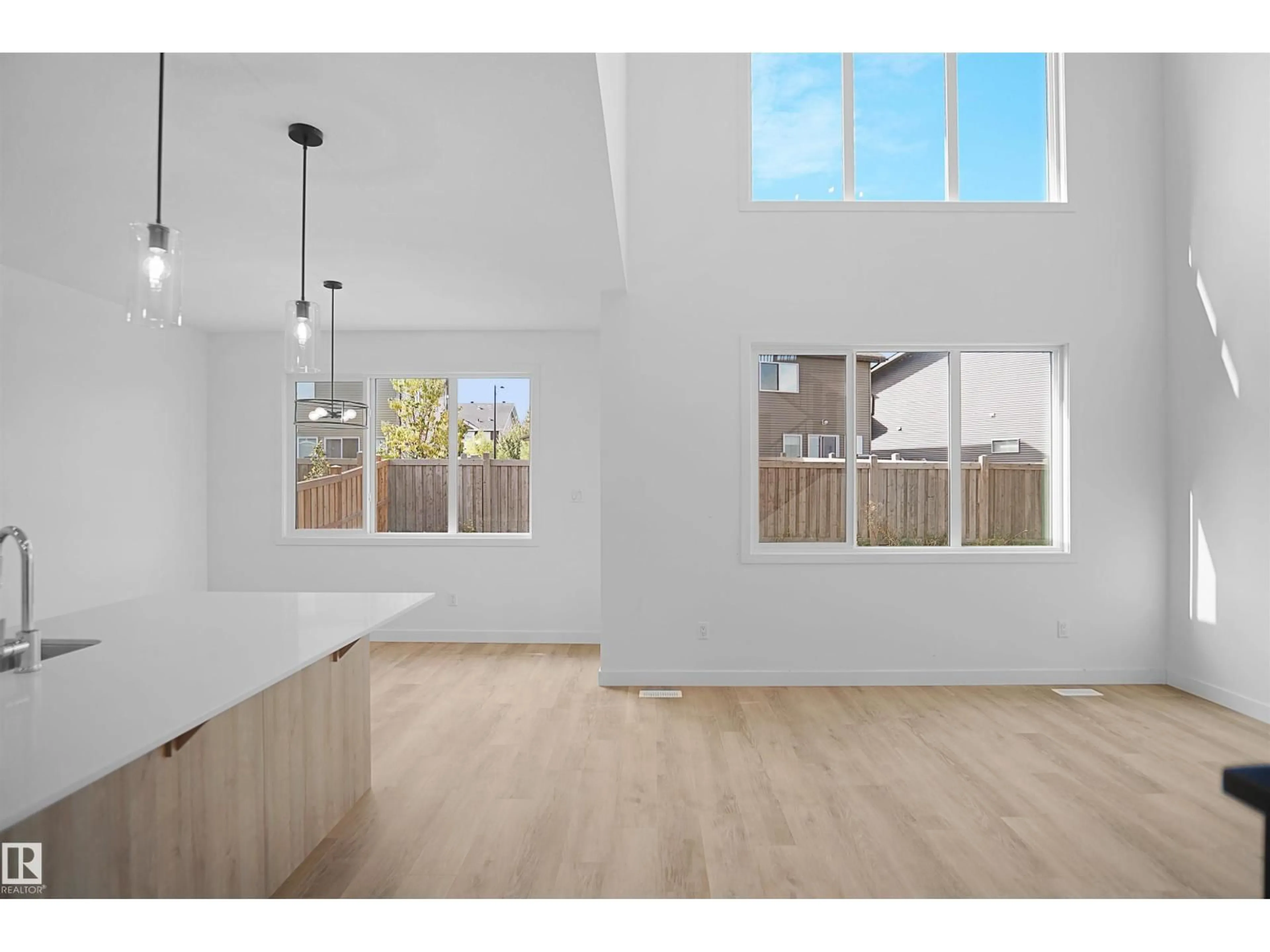 Open concept kitchen, wood/laminate floor for NE - 16539 3 ST, Edmonton Alberta T5T7H9
