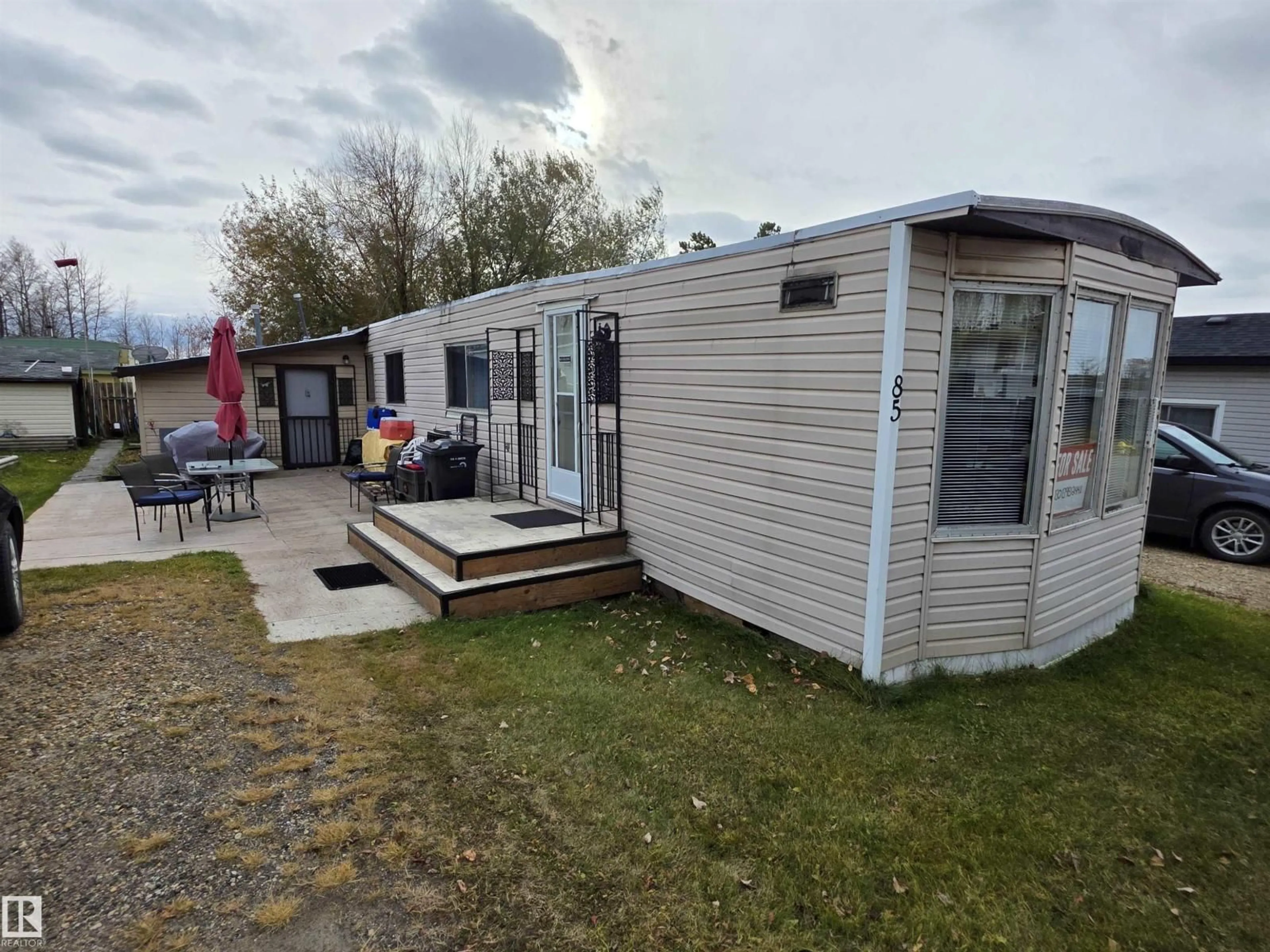 A pic from outside/outdoor area/front of a property/back of a property/a pic from drone, street for 85 - 2251 50 ST, Drayton Valley Alberta T7A1M9