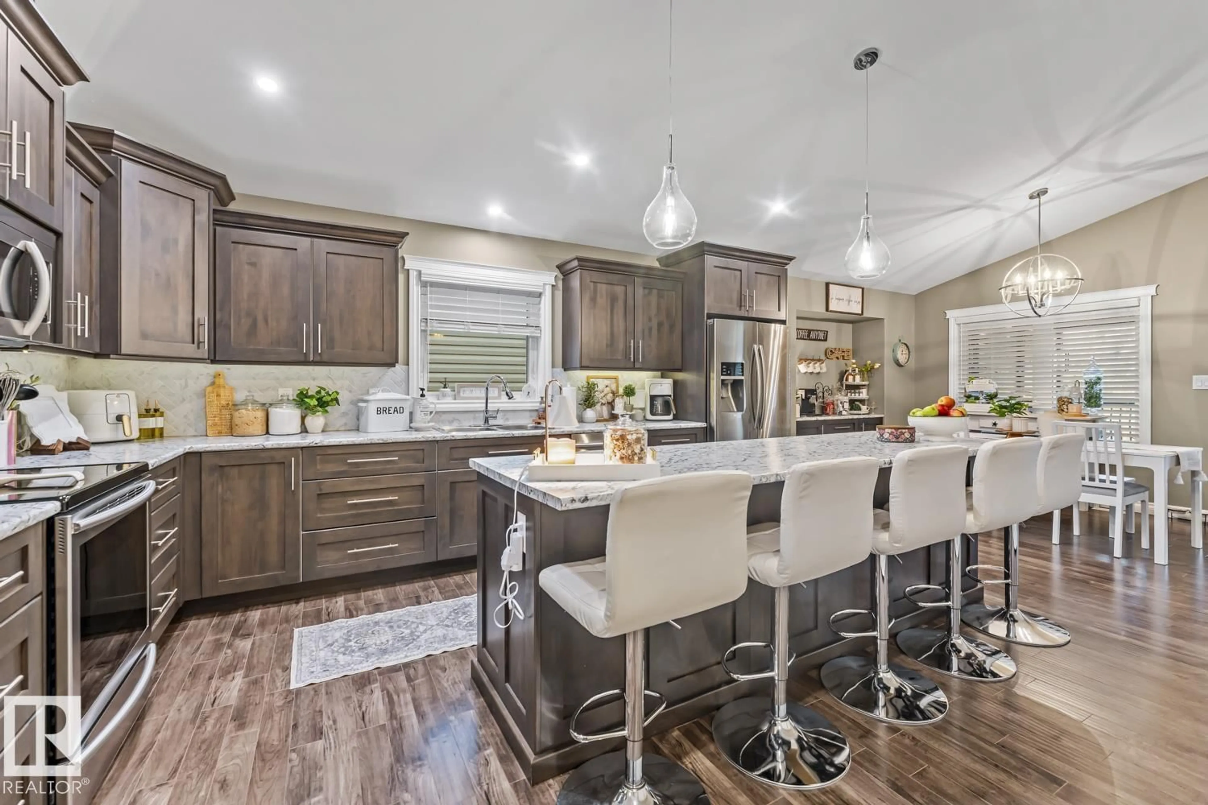 Open concept kitchen, wood/laminate floor for 239 TERRA NOVA CR, Cold Lake Alberta T9M0L5