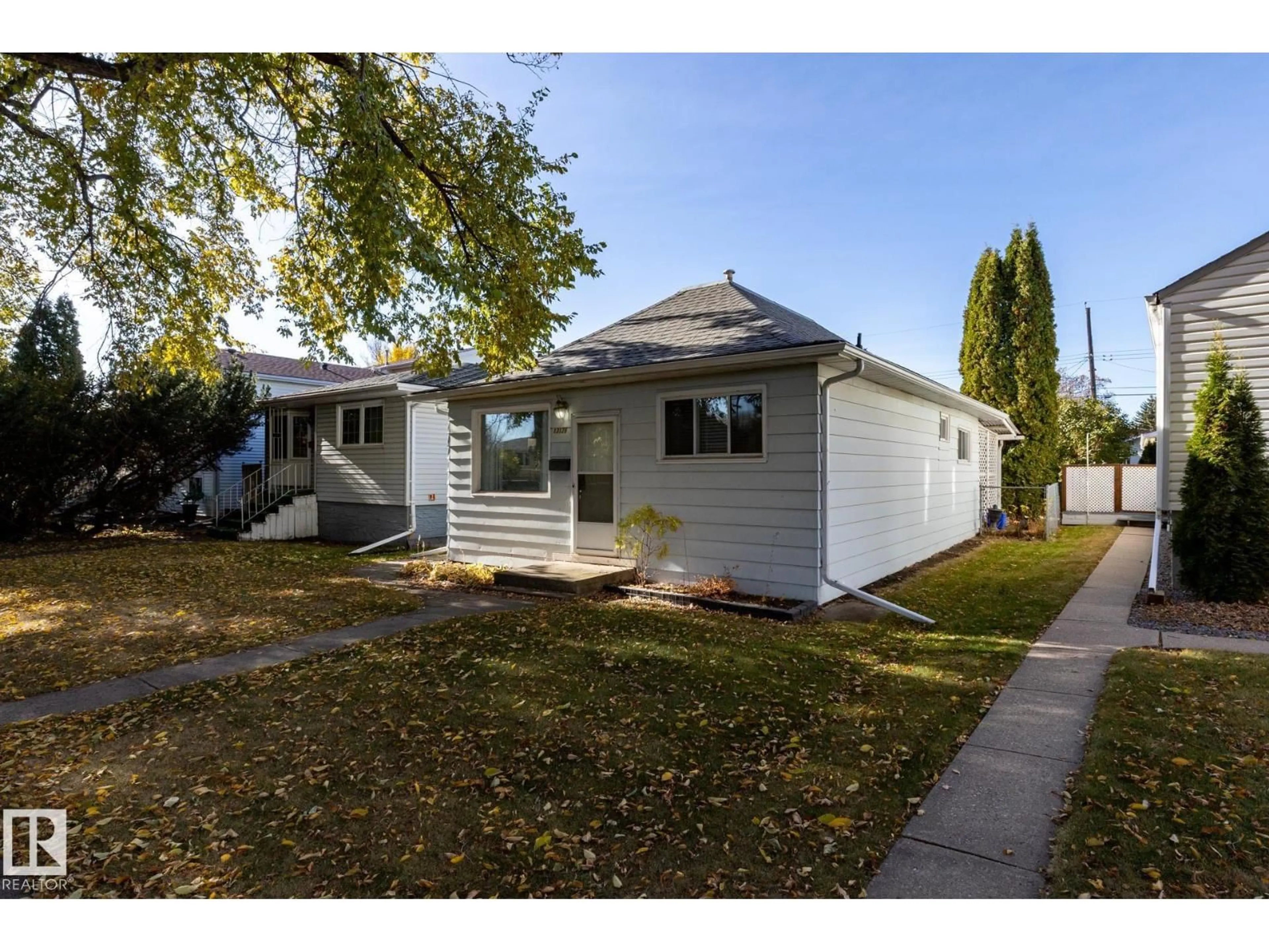 Home with vinyl exterior material, street for 13126 64 ST, Edmonton Alberta T5A0Y5