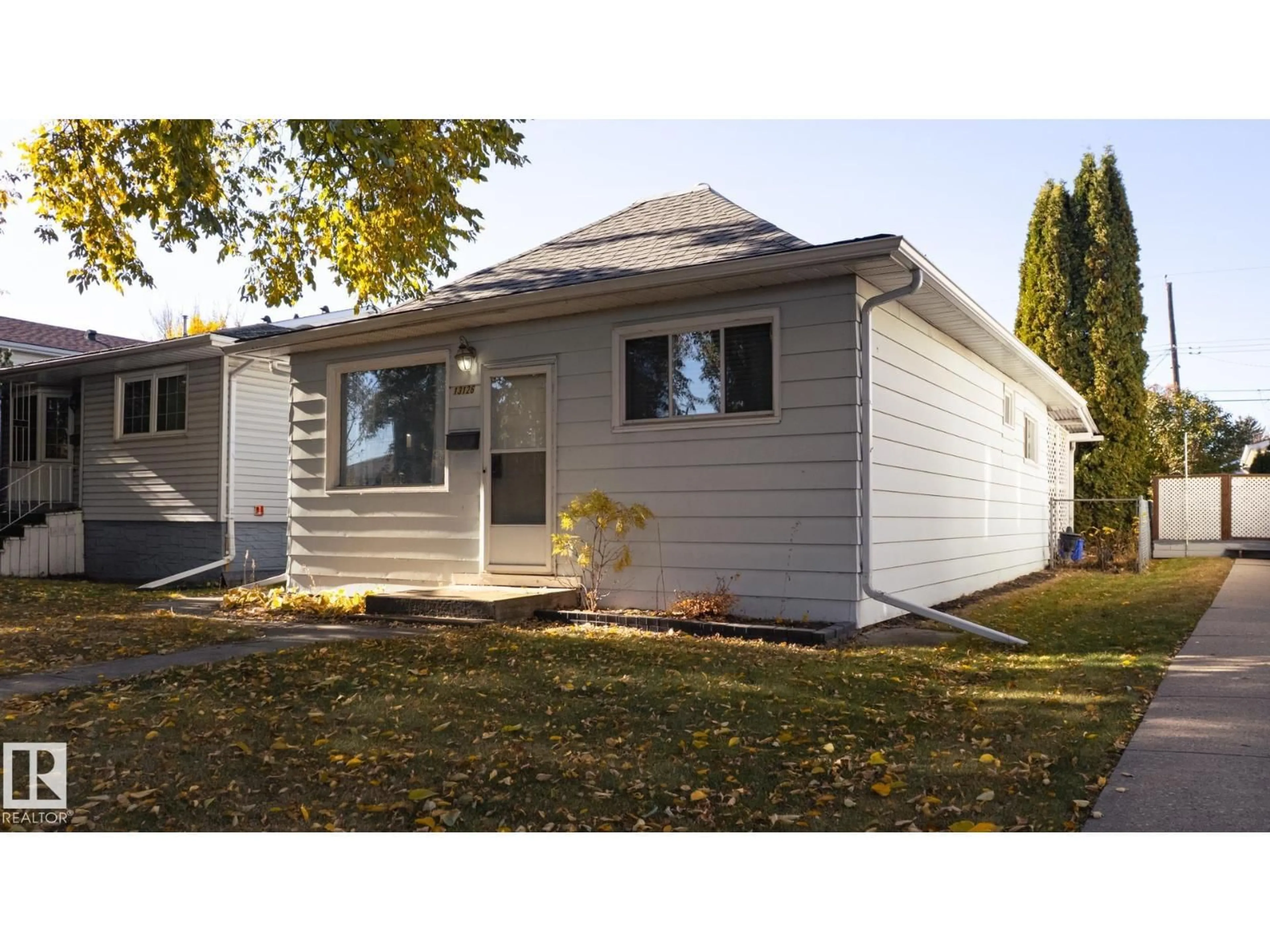 Home with vinyl exterior material, street for 13126 64 ST, Edmonton Alberta T5A0Y5