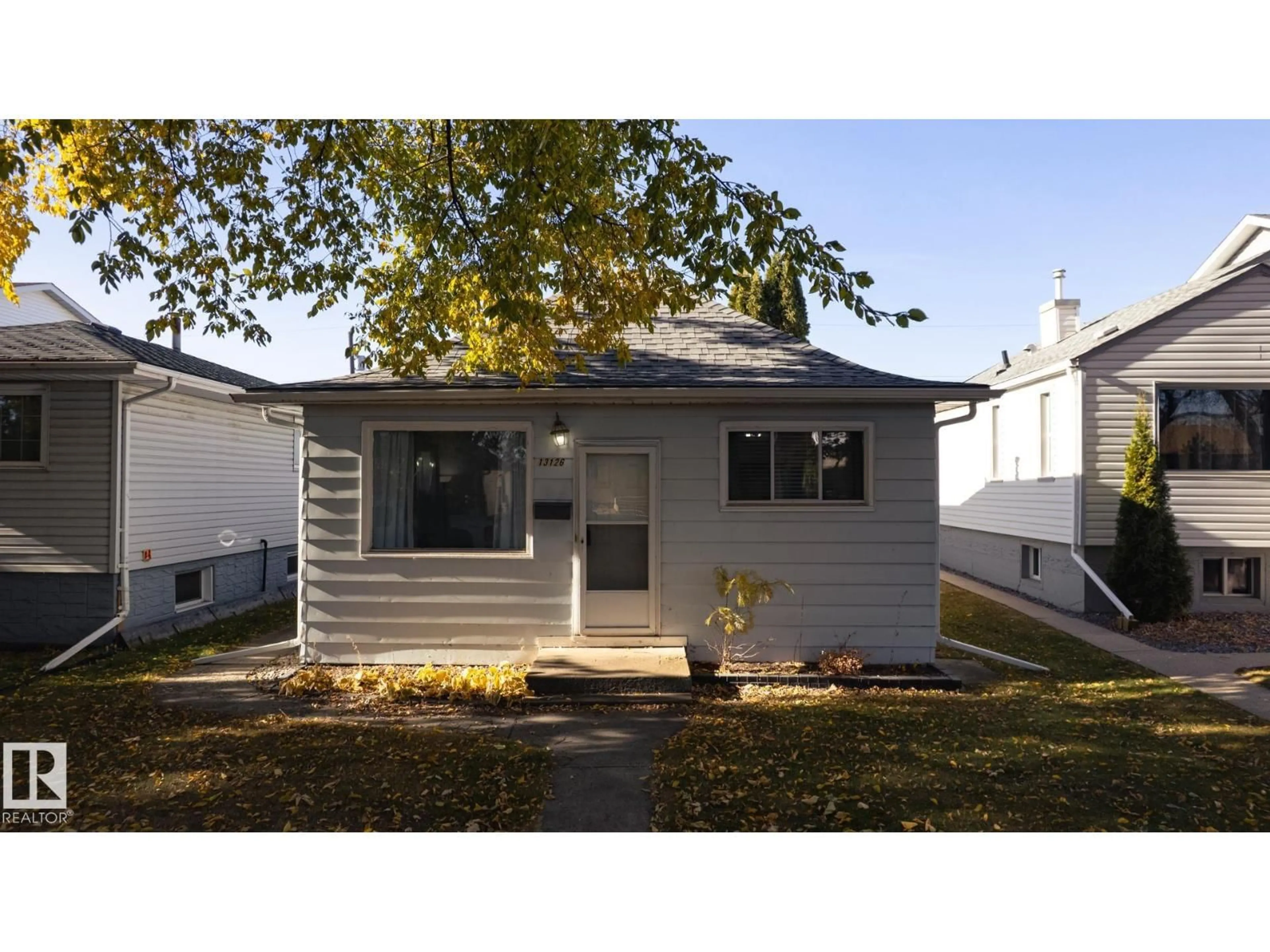 Home with vinyl exterior material, street for 13126 64 ST, Edmonton Alberta T5A0Y5
