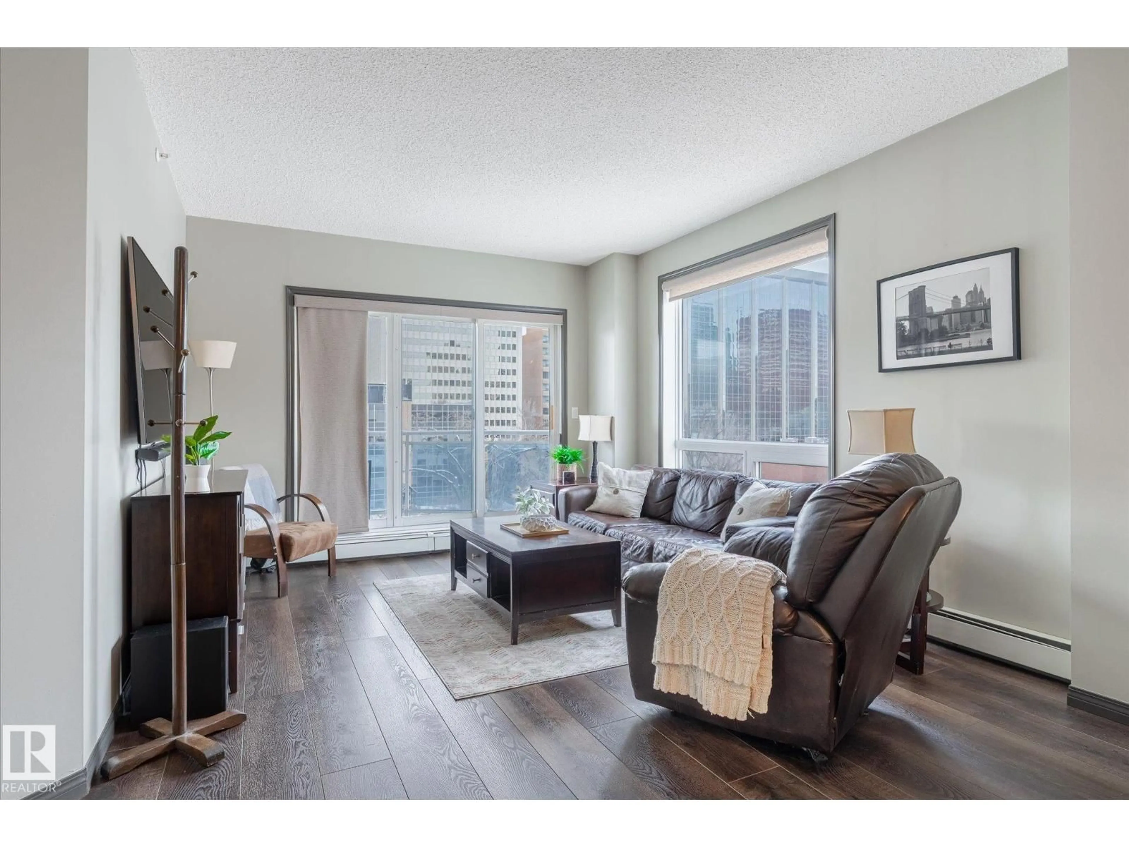 Living room with furniture, wood/laminate floor for #506 - 10504 99 AV, Edmonton Alberta T5K1B2