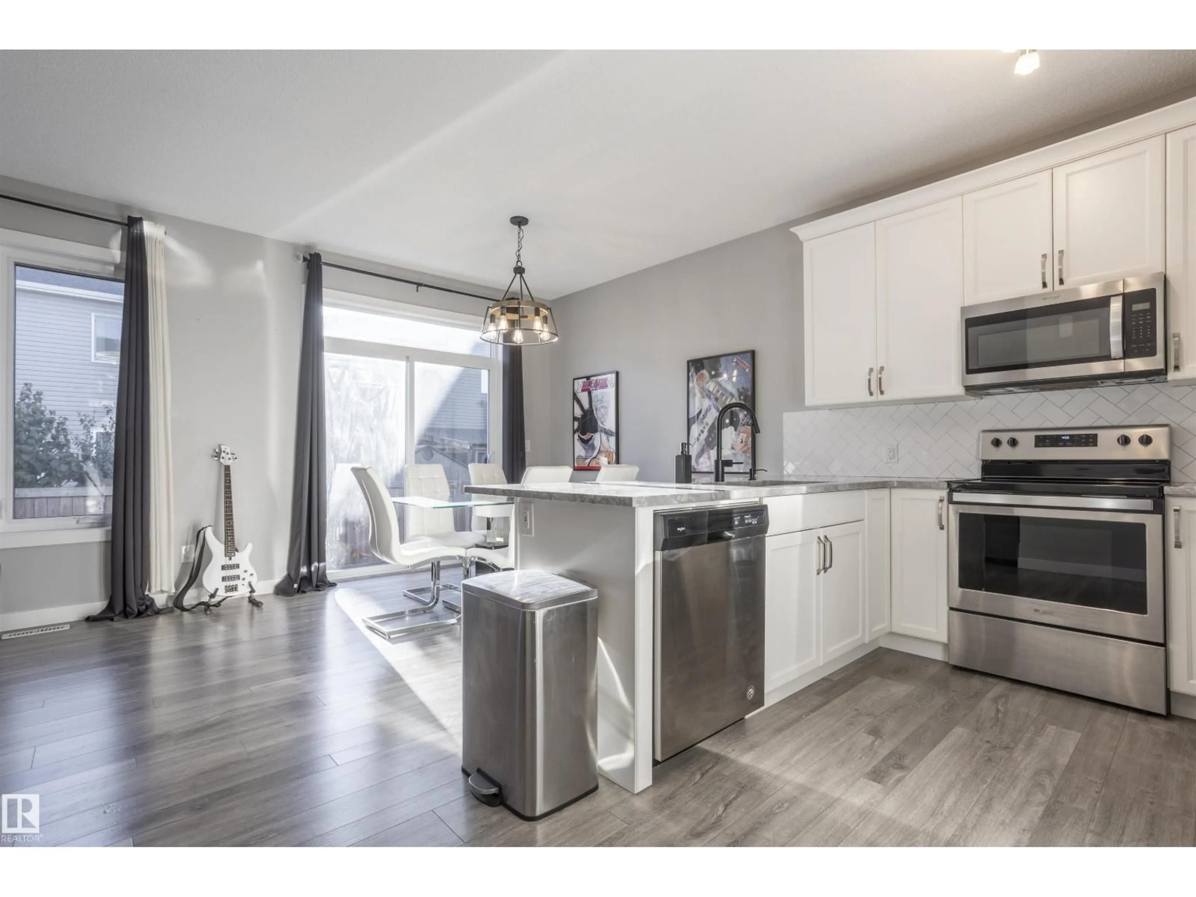 Open concept kitchen, wood/laminate floor for NW - 20031 18 AV, Edmonton Alberta T6M0Y1