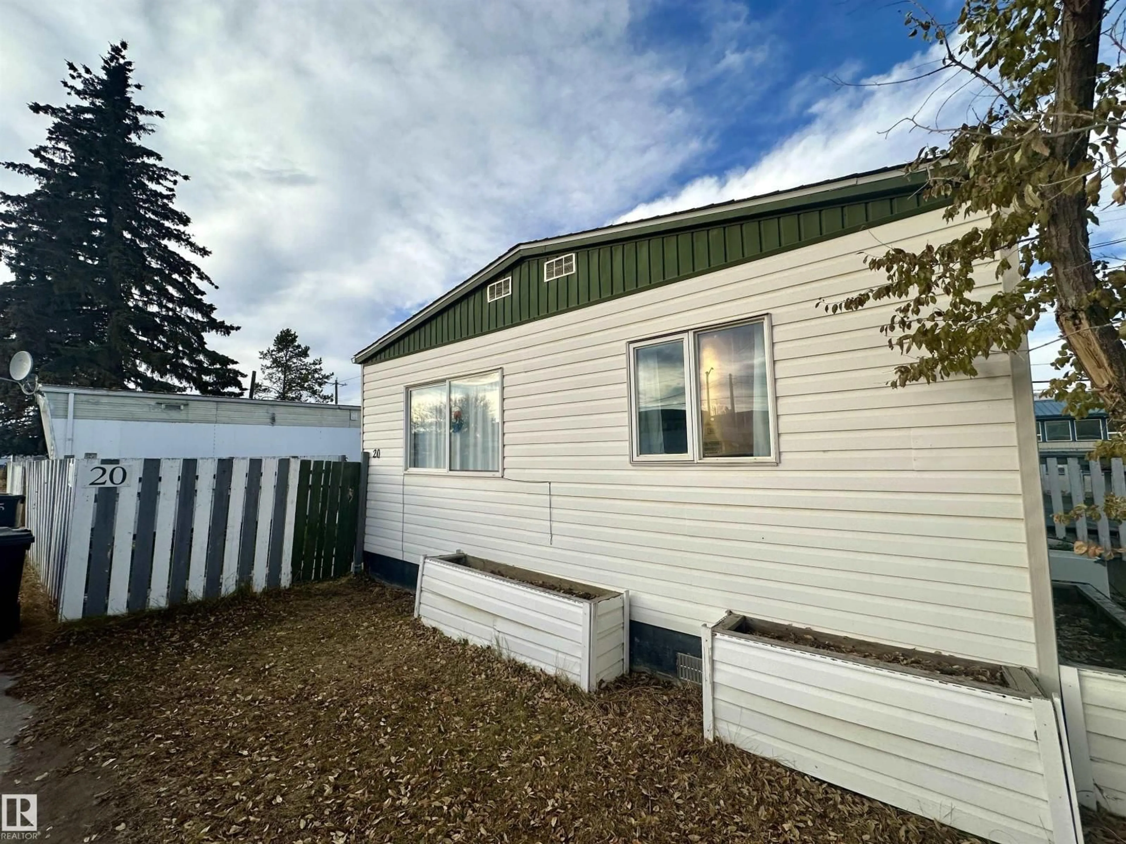 Home with vinyl exterior material, street for 5302 - 20 52 ST, Drayton Valley Alberta T7A1L5