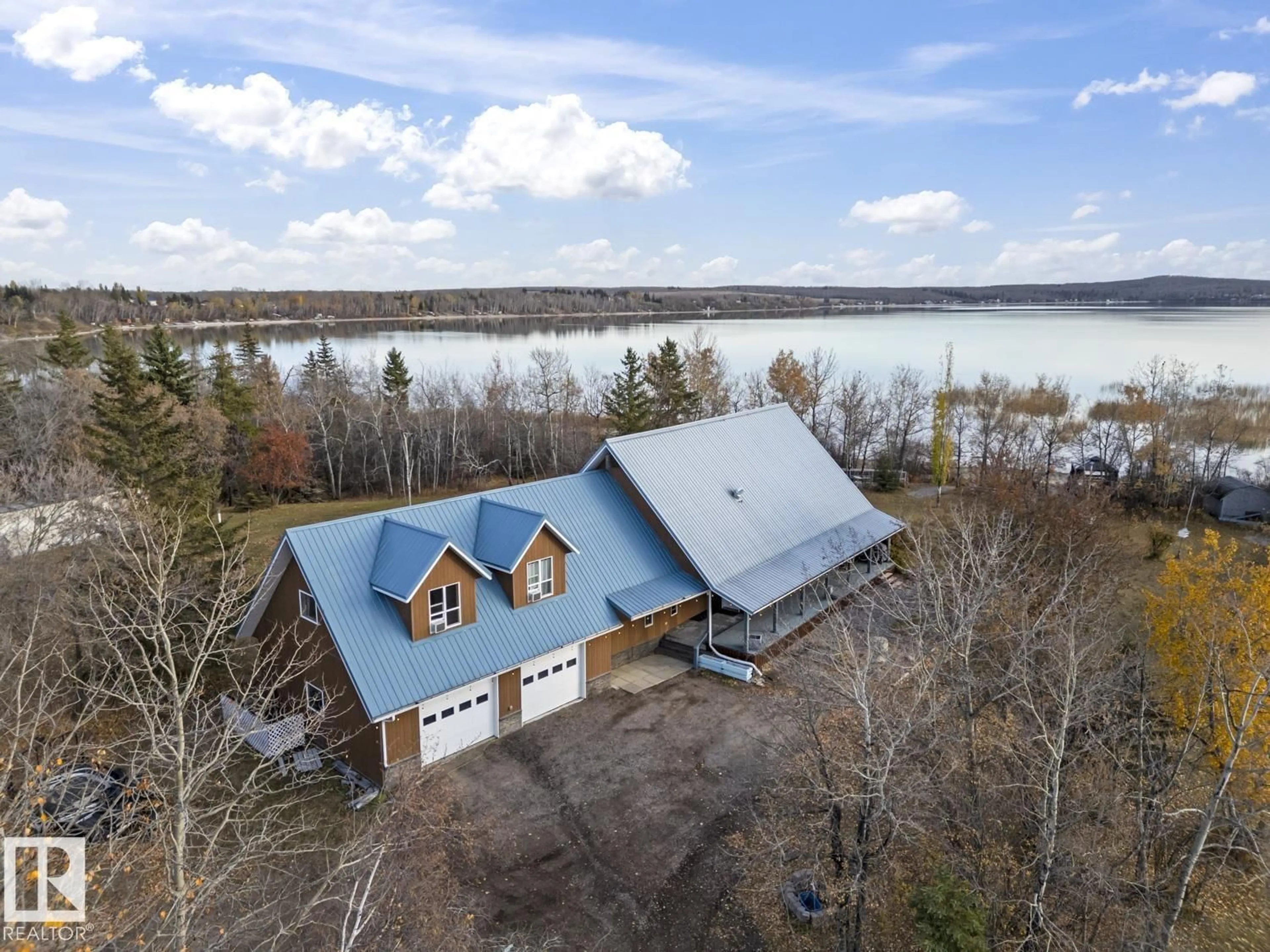 A pic from outside/outdoor area/front of a property/back of a property/a pic from drone, water/lake/river/ocean view for 61025A RGE RD 465, Rural Bonnyville M.D. Alberta T9N2J6