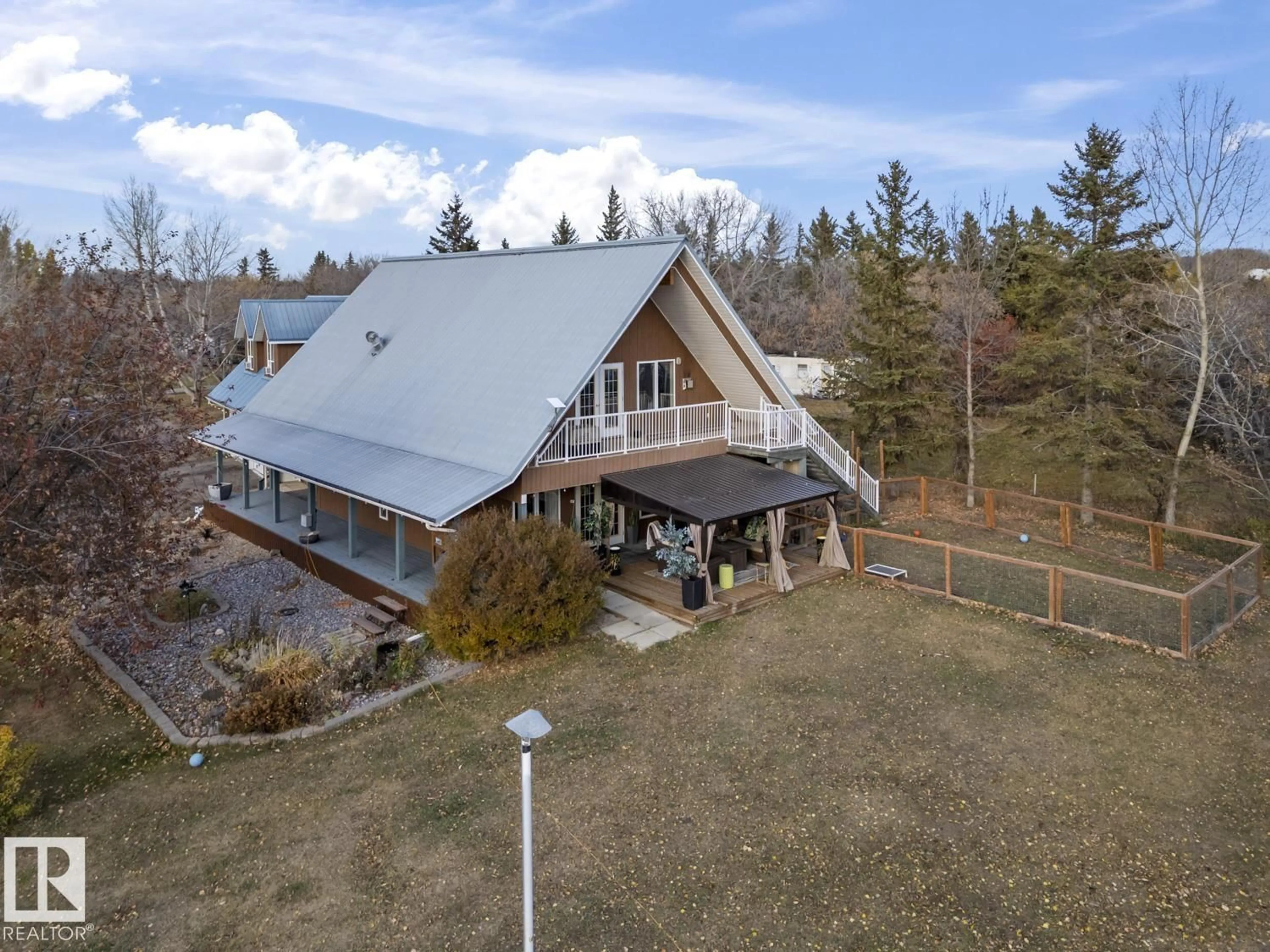 A pic from outside/outdoor area/front of a property/back of a property/a pic from drone, mountain view for 61025A RGE RD 465, Rural Bonnyville M.D. Alberta T9N2J6