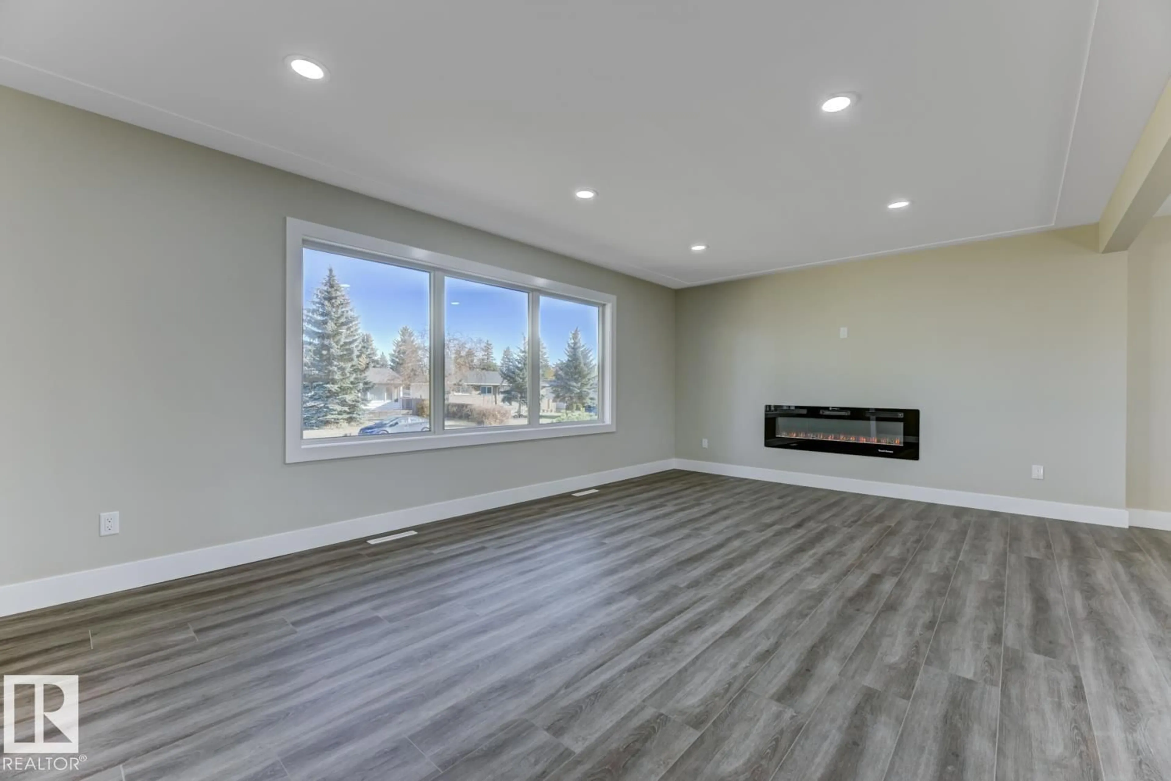 Living room with furniture, wood/laminate floor for NW - 12904 95A ST, Edmonton Alberta T5E4A1