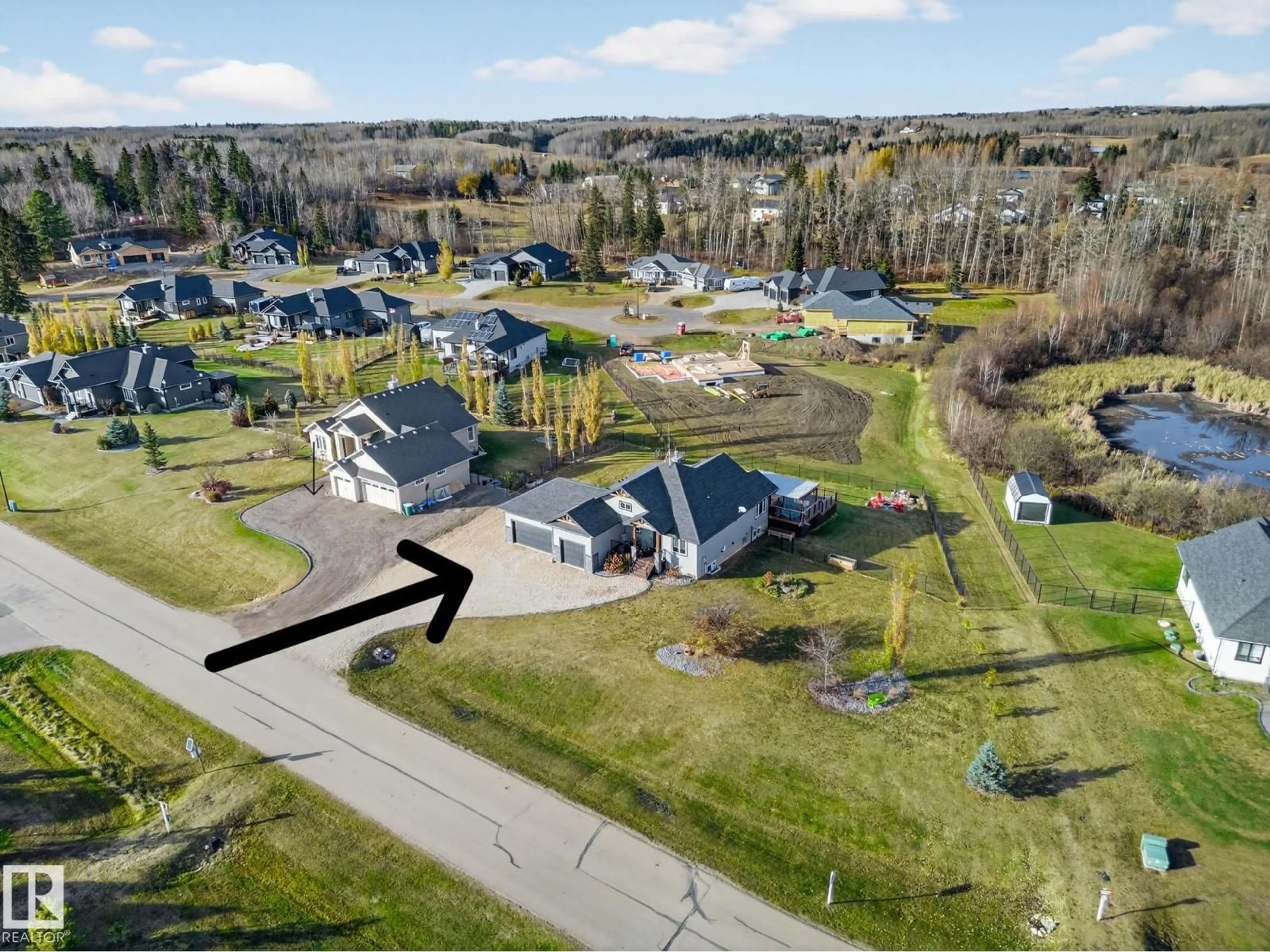 A pic from outside/outdoor area/front of a property/back of a property/a pic from drone, street for 2035 SPRING LAKE DR, Rural Parkland County Alberta T7Z0G8