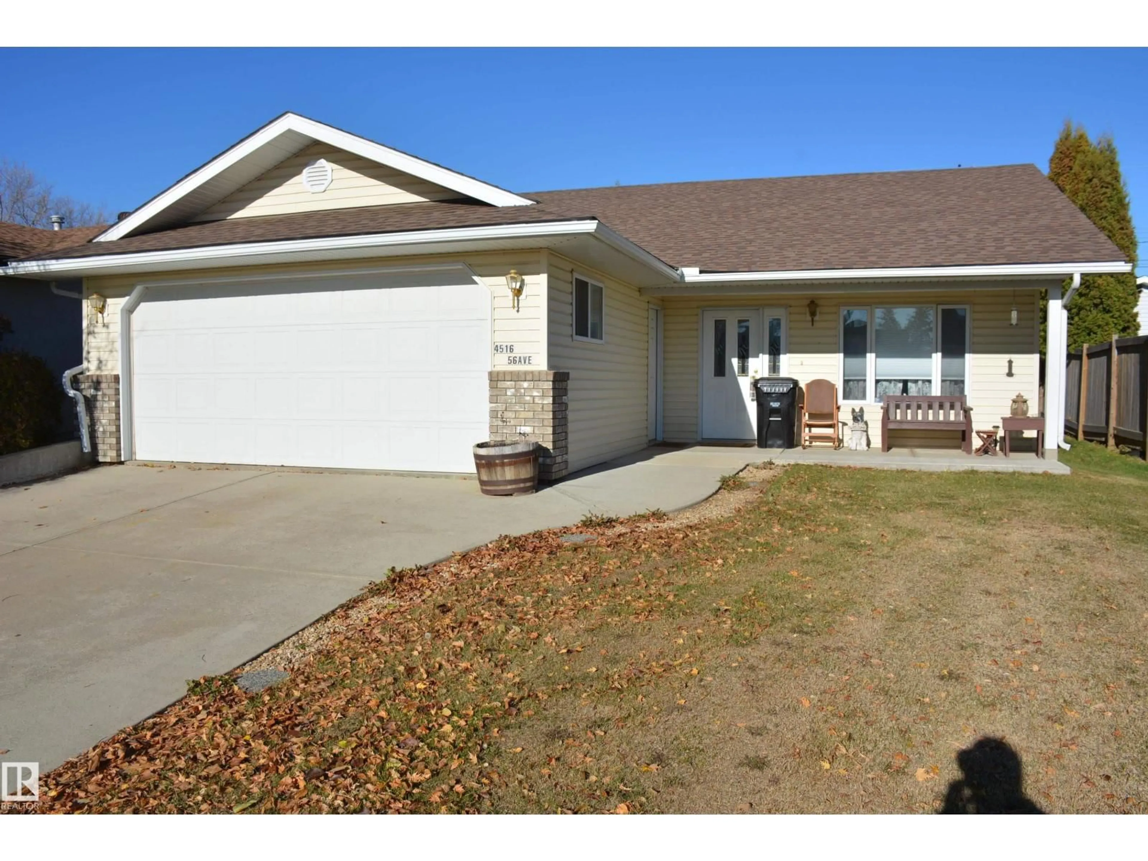 Home with vinyl exterior material, street for 4516 56 AV, Barrhead Alberta T7N1A3