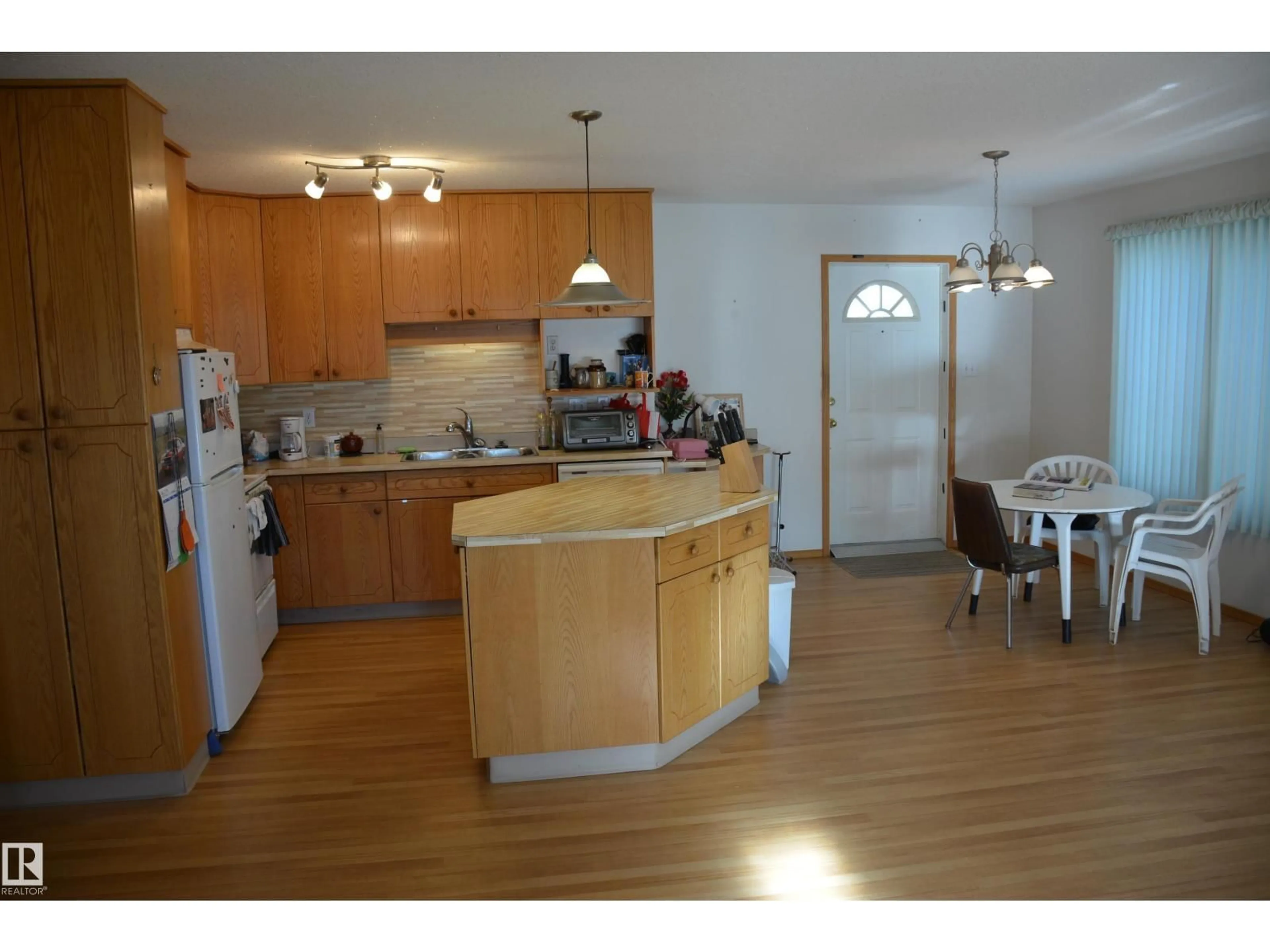 Open concept kitchen, wood/laminate floor for 4516 56 AV, Barrhead Alberta T7N1A3