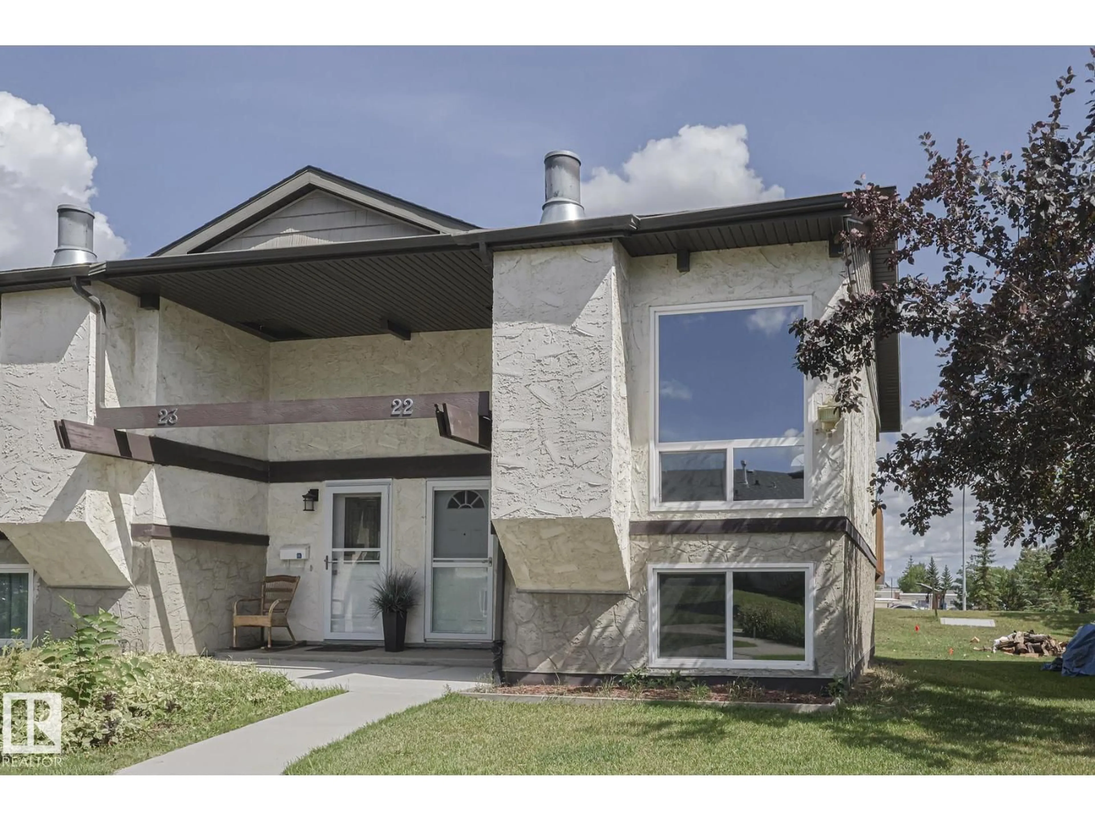 Home with vinyl exterior material, street for 22 NORTHWOODS VG, Edmonton Alberta T5X1T2