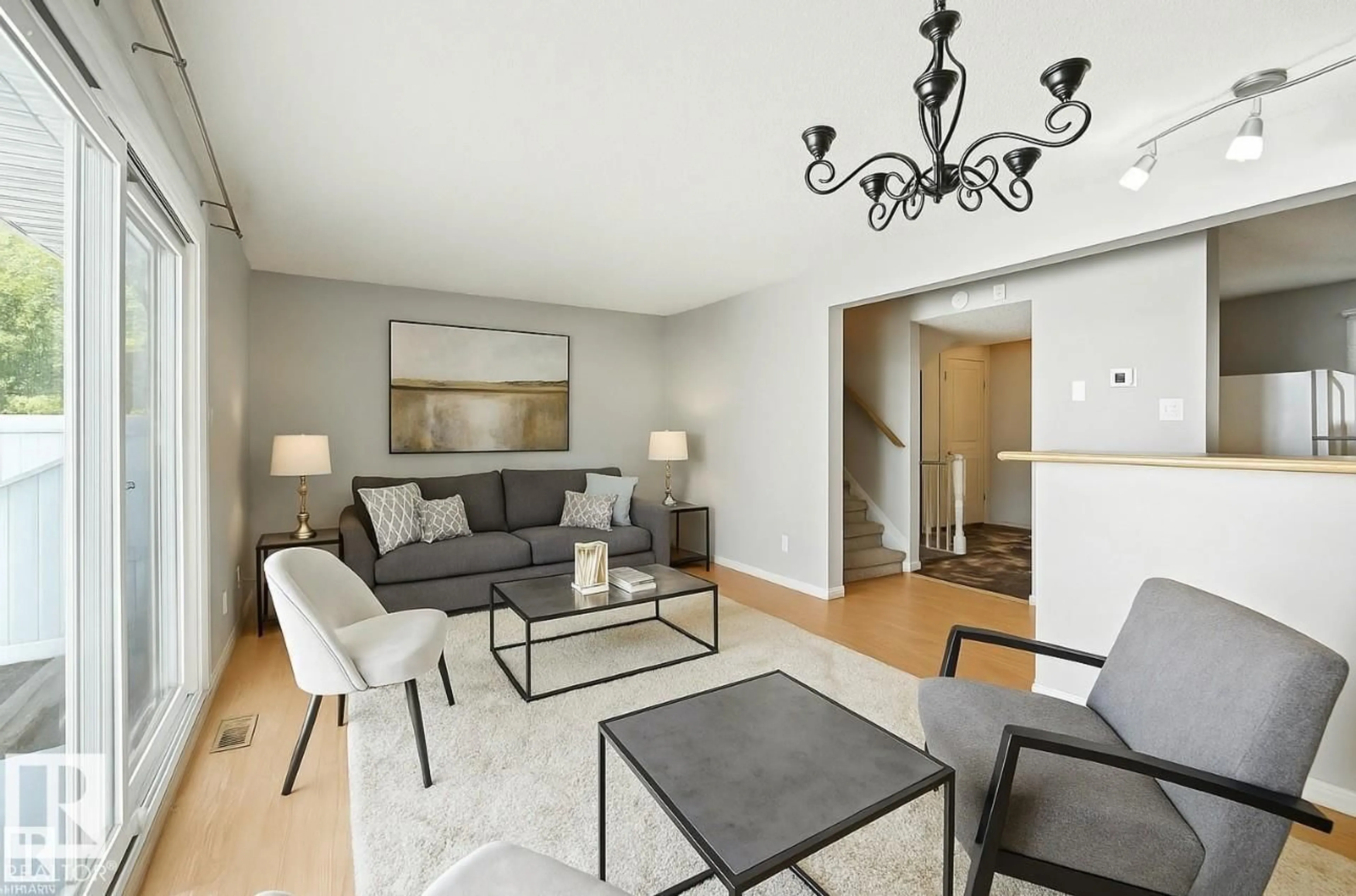 Living room with furniture, unknown for 11406 139 AV, Edmonton Alberta T5X3L4