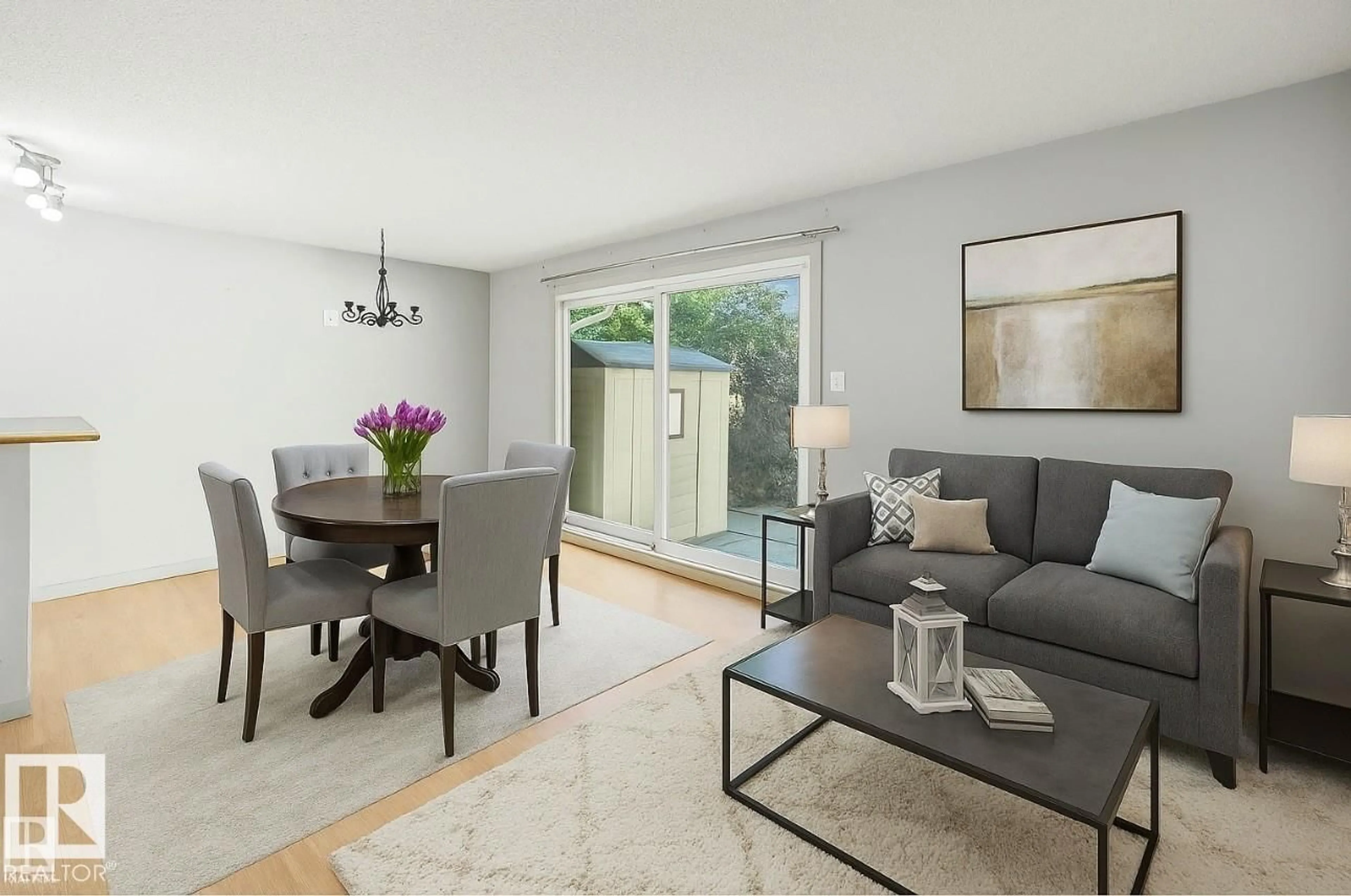 Living room with furniture, wood/laminate floor for 11406 139 AV, Edmonton Alberta T5X3L4