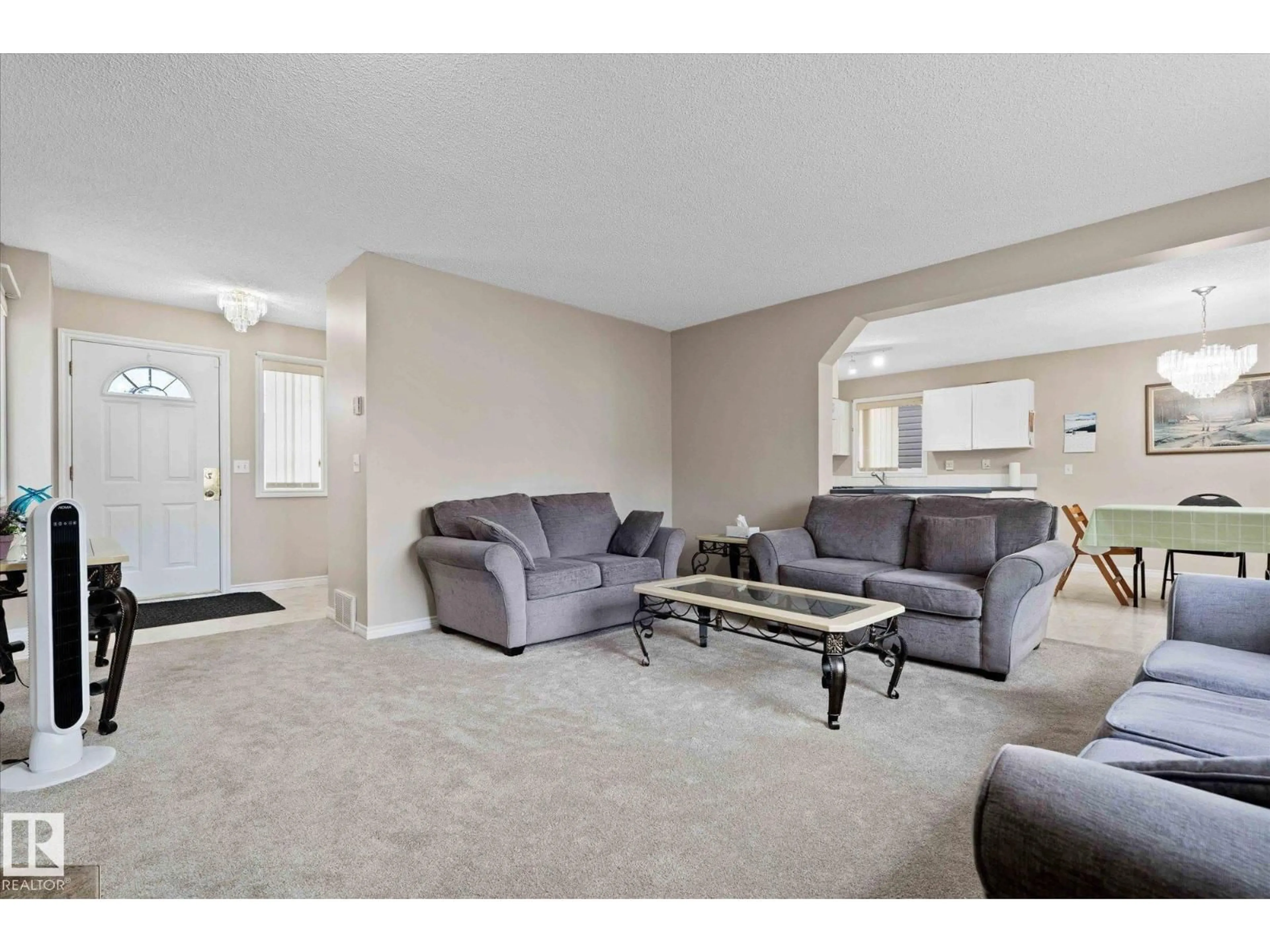 Living room with furniture, carpet floor for NW - 4804 147 AV, Edmonton Alberta T5Y2X2