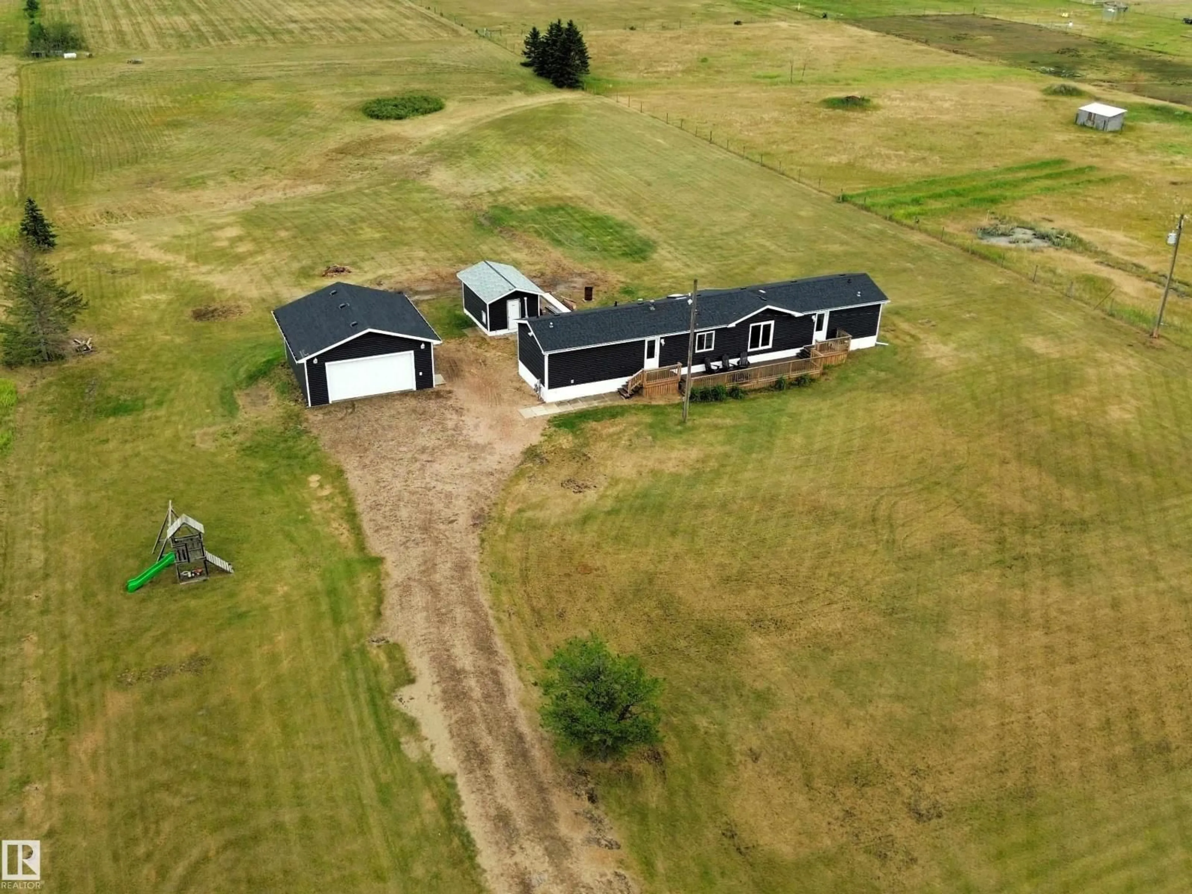 A pic from outside/outdoor area/front of a property/back of a property/a pic from drone, building for 42 RICHFIELD RD, Rural Sturgeon County Alberta T0G1L2