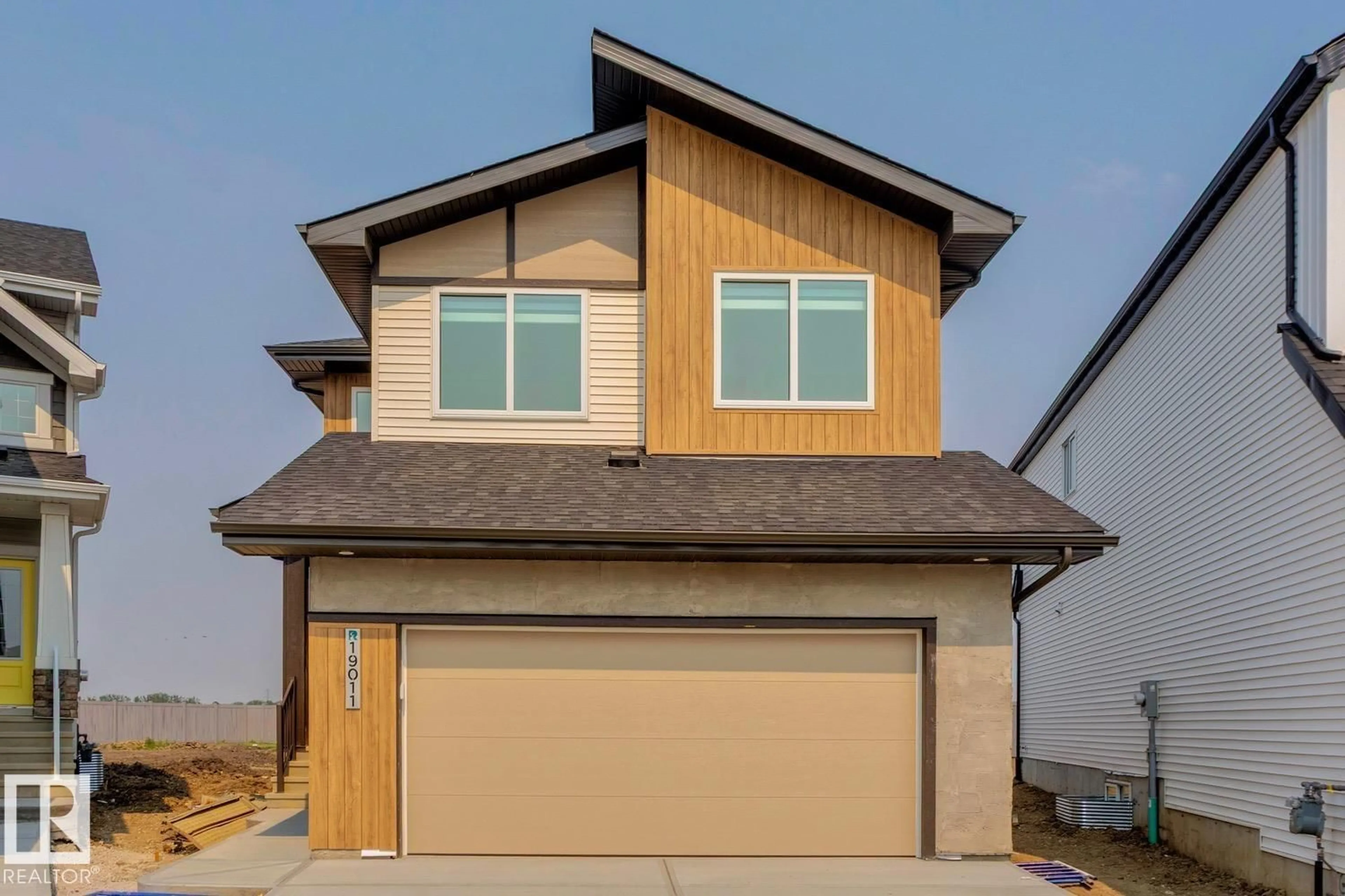 Home with vinyl exterior material, street for NW - 19011 20 AV, Edmonton Alberta T6M3E8