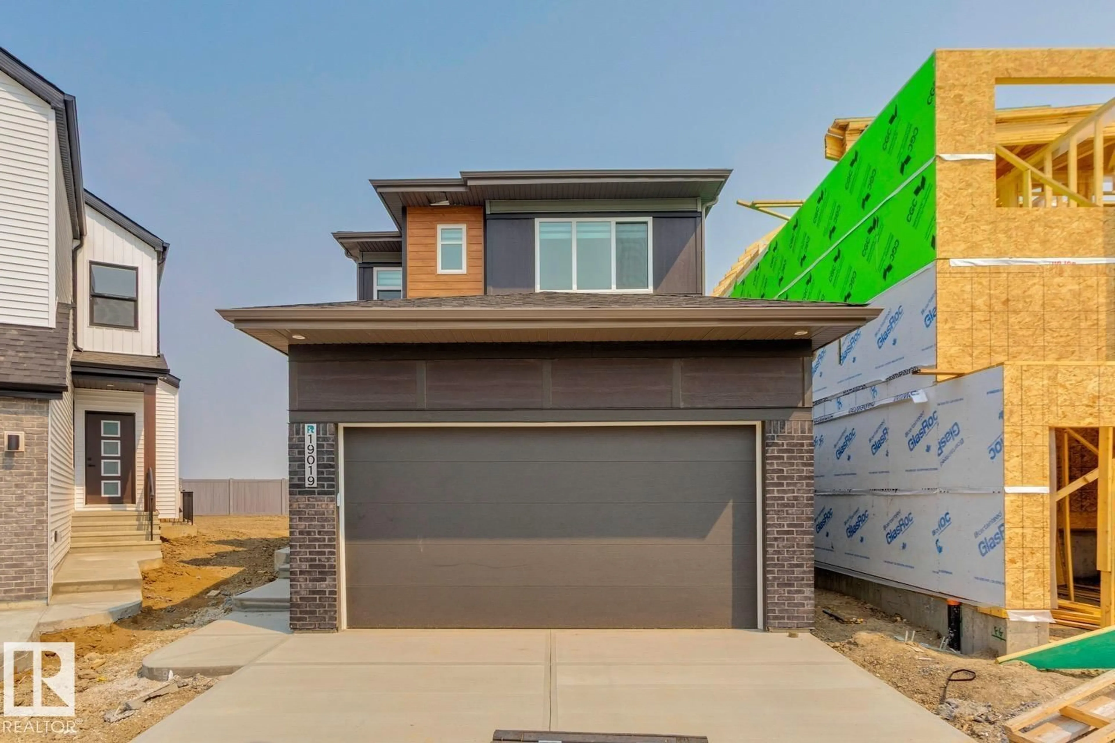 Home with brick exterior material, street for 19019 20 AV, Edmonton Alberta T6M3E8