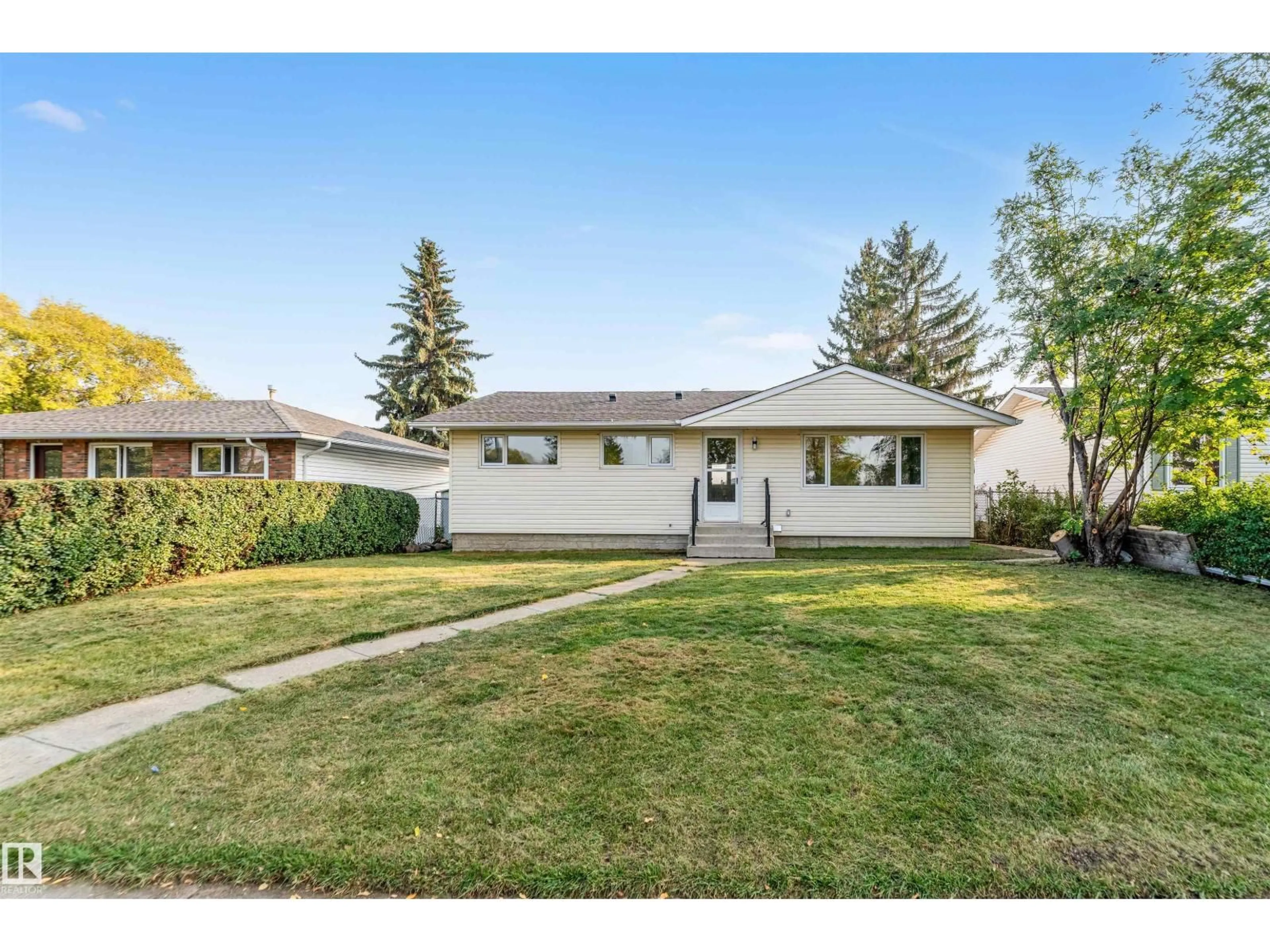 Home with vinyl exterior material, street for 5907 137 AV, Edmonton Alberta T5A0P1