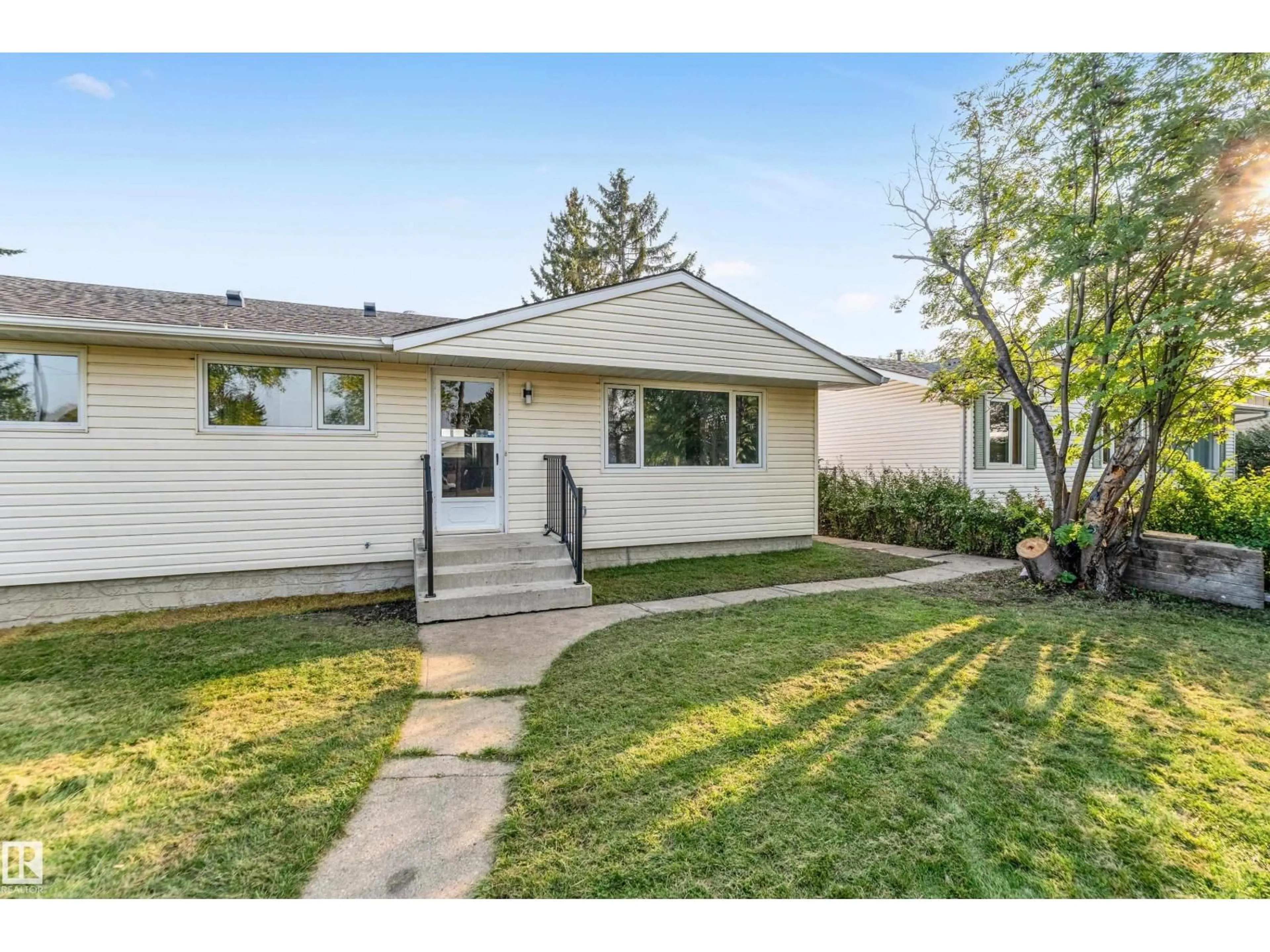 Home with vinyl exterior material, street for 5907 137 AV, Edmonton Alberta T5A0P1