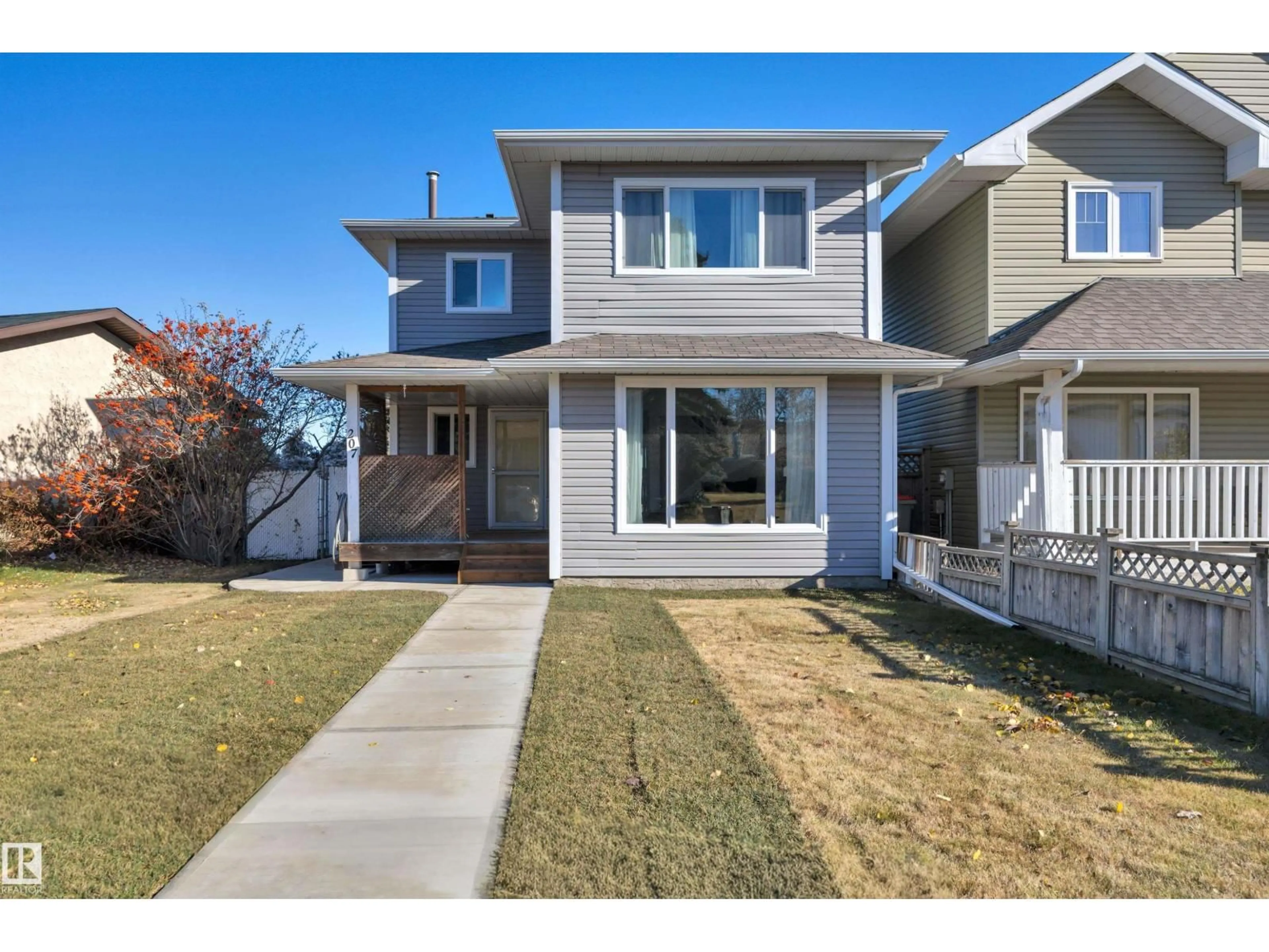 Home with vinyl exterior material, street for 207 LIBERTY DR, Millet Alberta T0C1Z0
