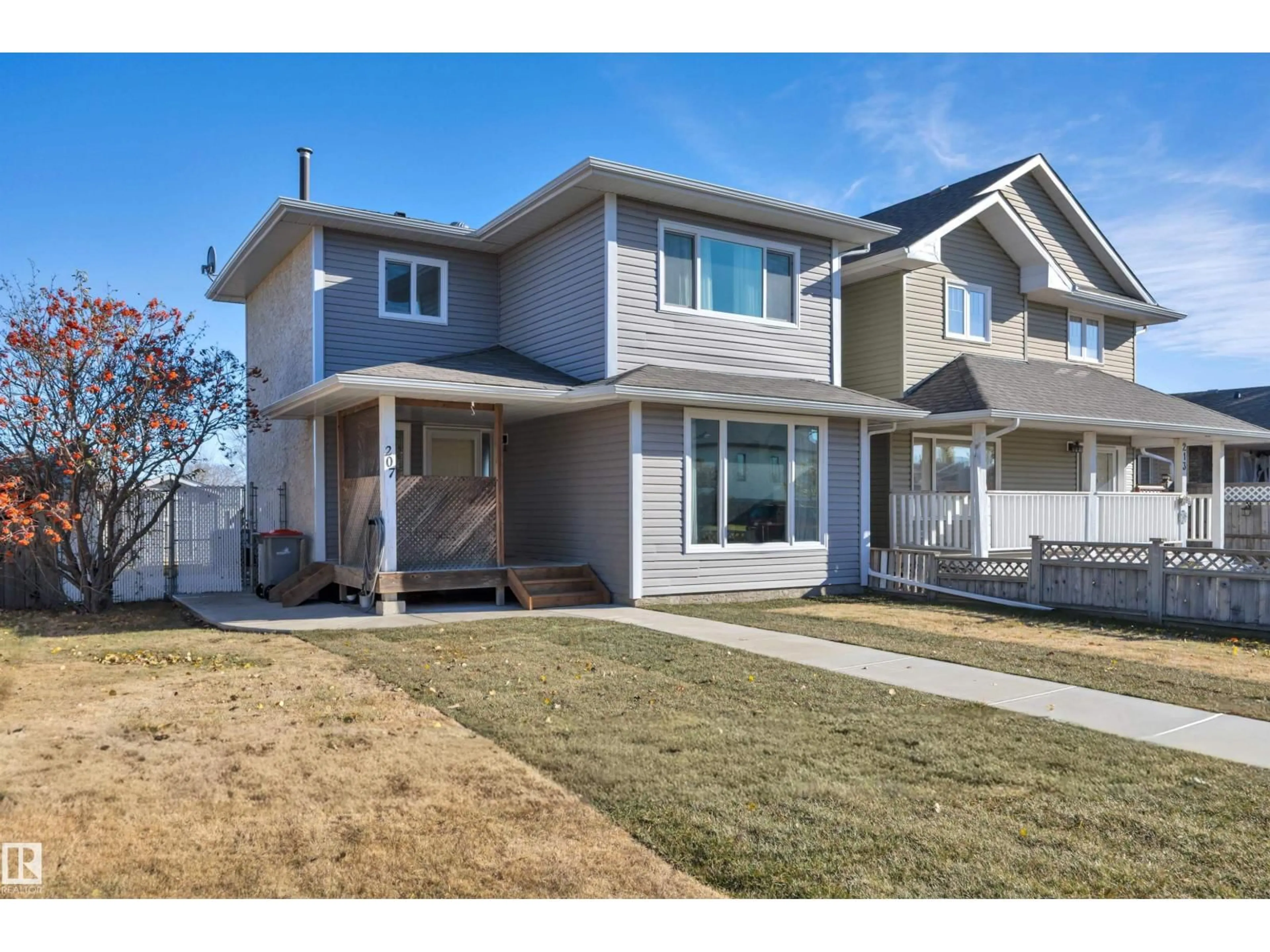 Home with vinyl exterior material, street for 207 LIBERTY DR, Millet Alberta T0C1Z0