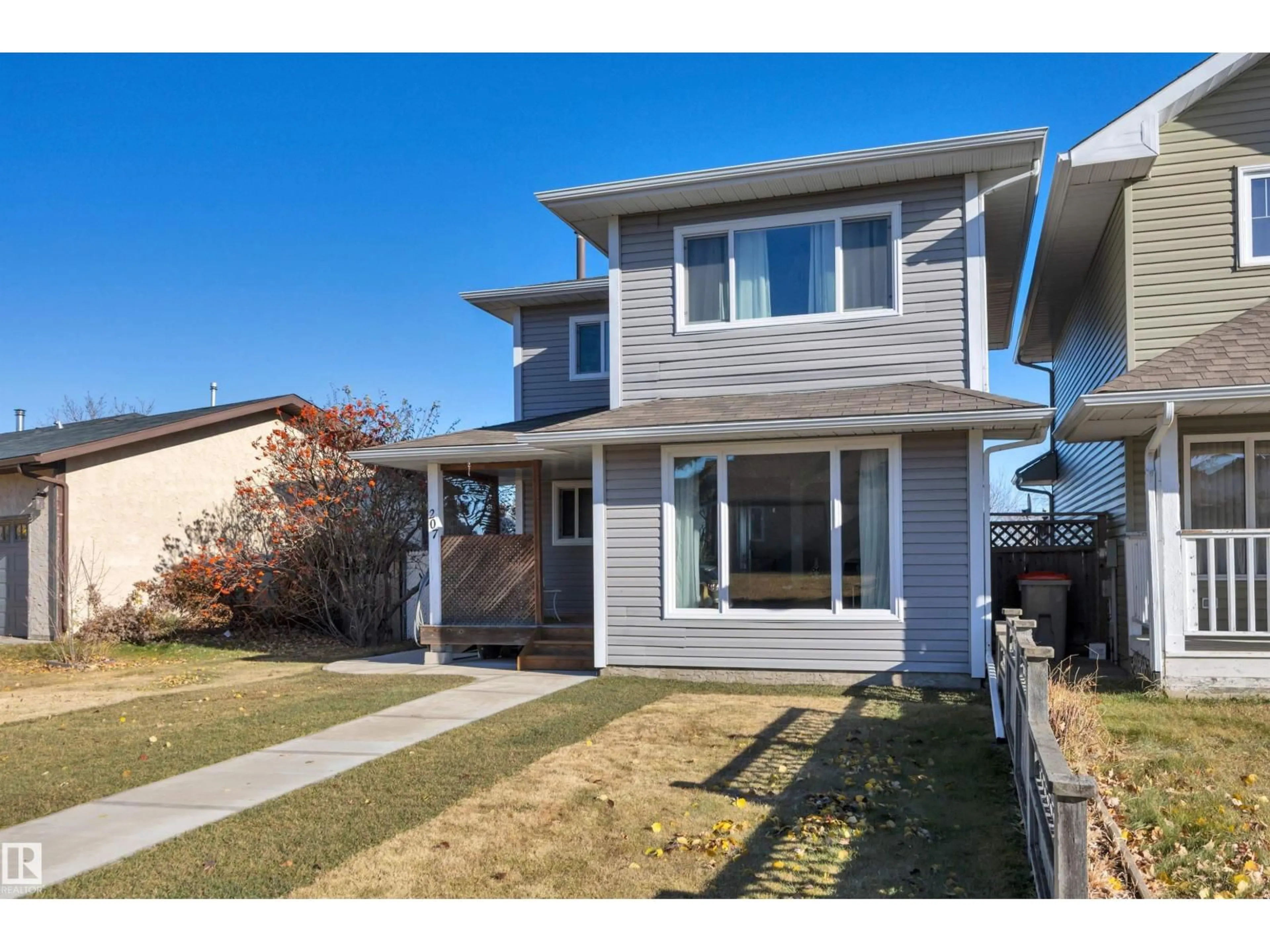 Home with vinyl exterior material, street for 207 LIBERTY DR, Millet Alberta T0C1Z0