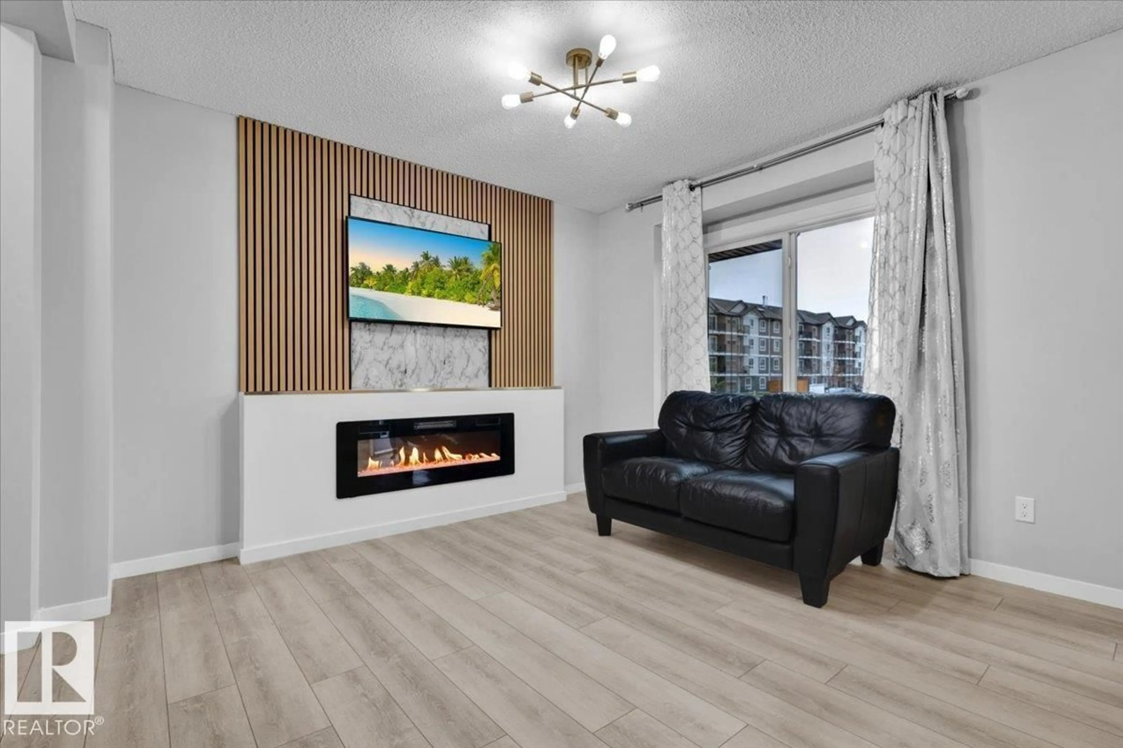Living room with furniture, wood/laminate floor for 1248 ROSENTHAL BV, Edmonton Alberta T5T7N6