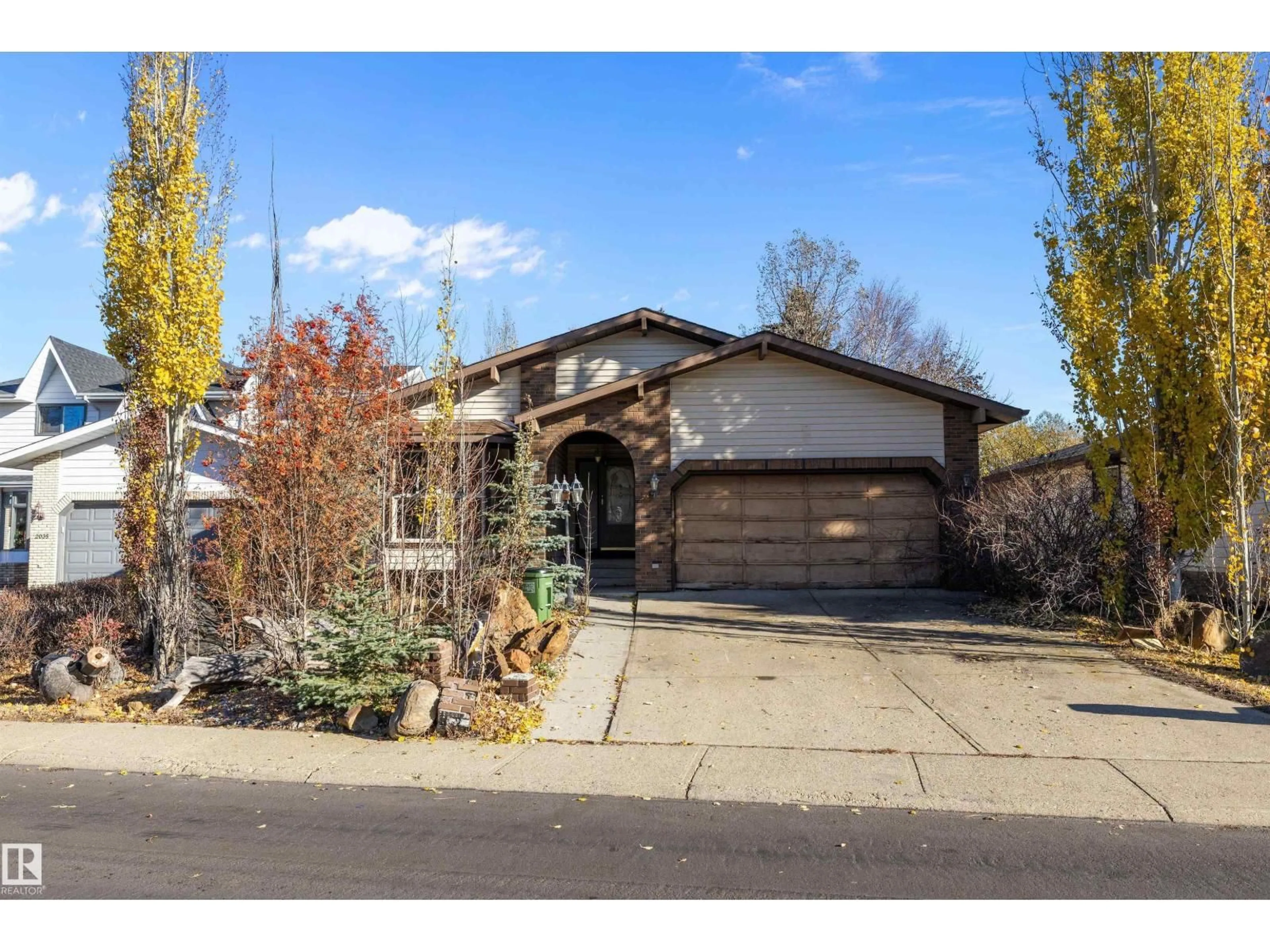 Home with brick exterior material, street for 2031 104A ST, Edmonton Alberta T6J5A6