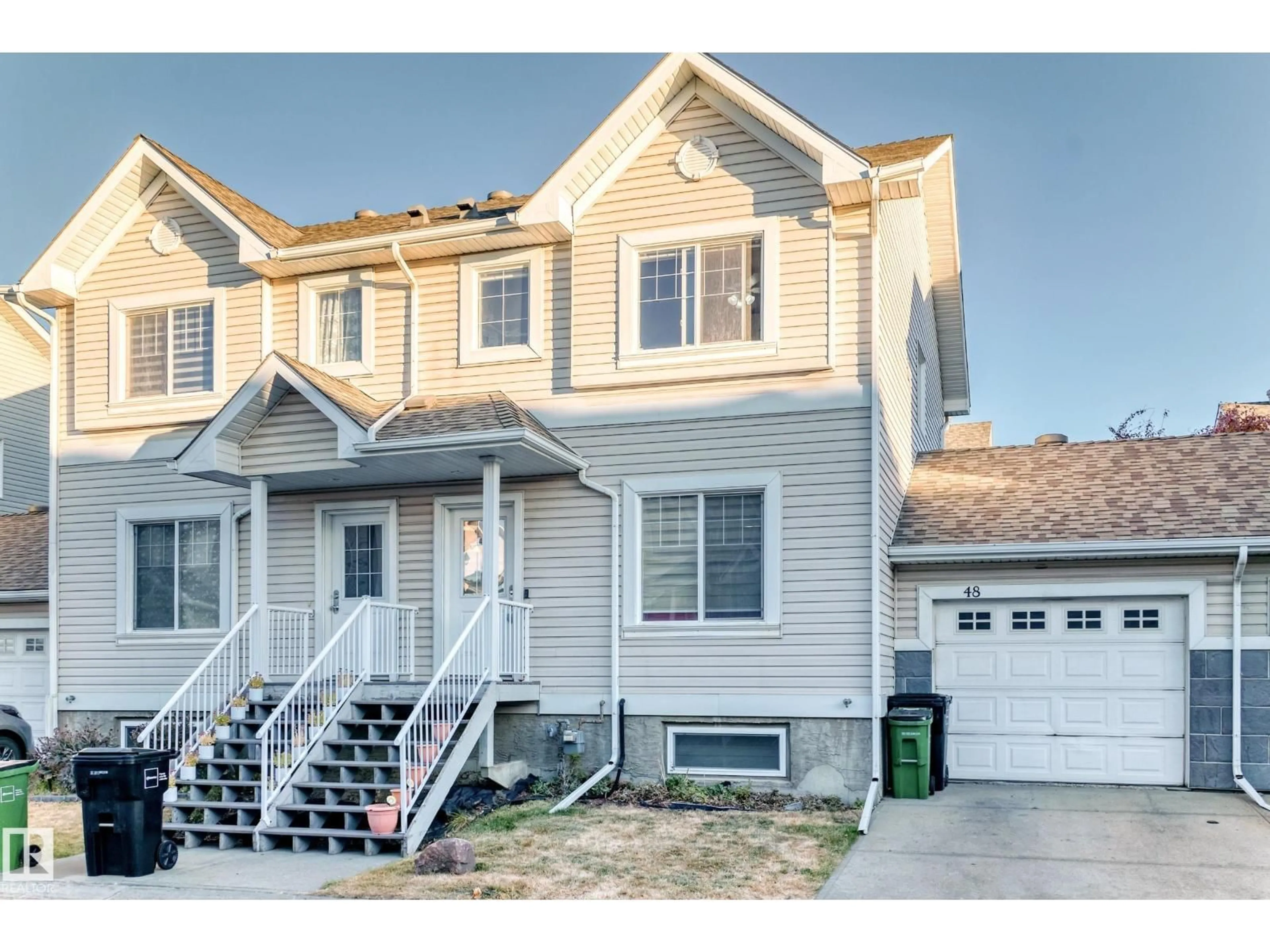 Home with vinyl exterior material, street for 2503 24 ST, Edmonton Alberta T6T0B5