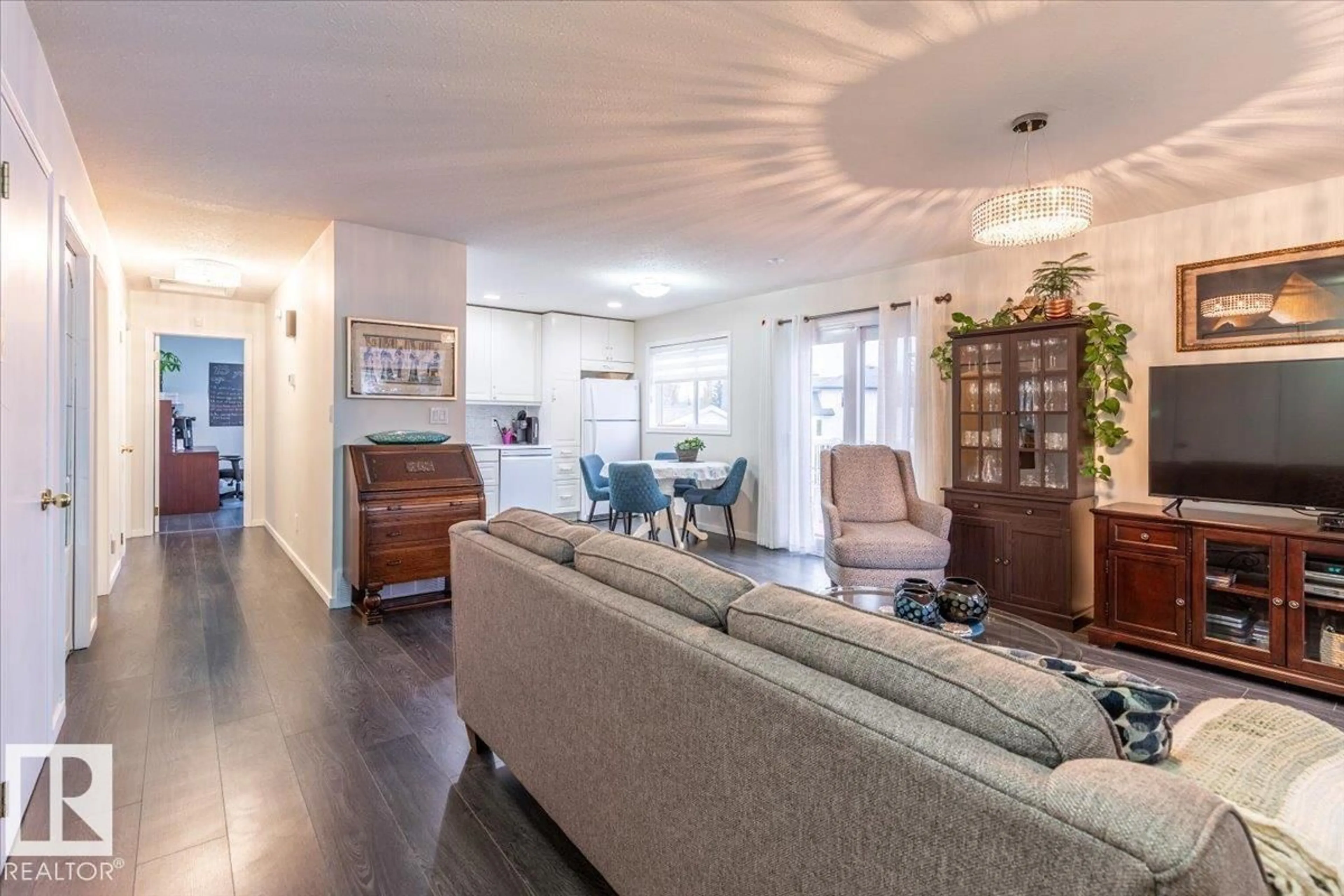 Living room with furniture, wood/laminate floor for 16 4410 52 AV, Wetaskiwin Alberta T9A3L9