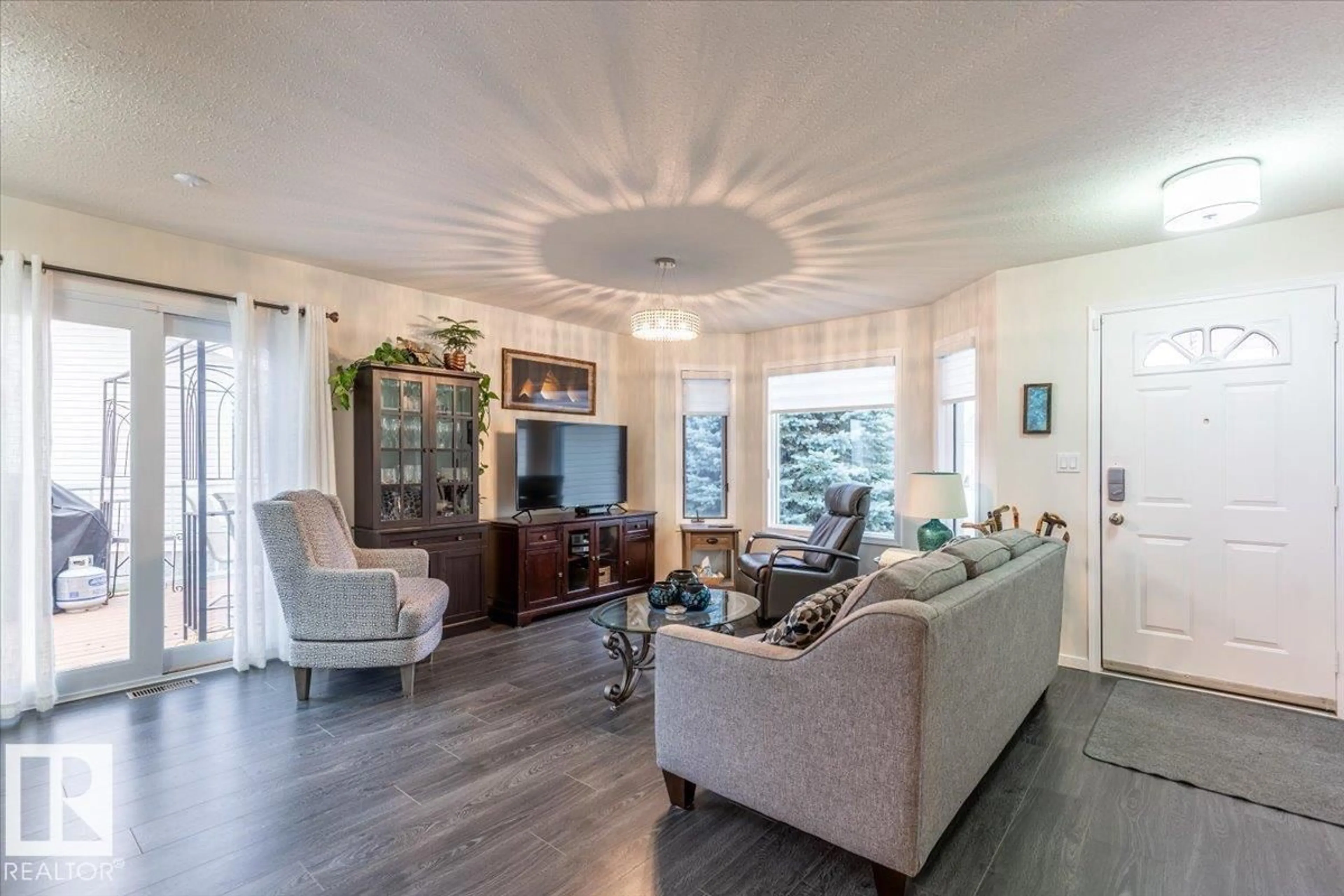 Living room with furniture, wood/laminate floor for 16 4410 52 AV, Wetaskiwin Alberta T9A3L9