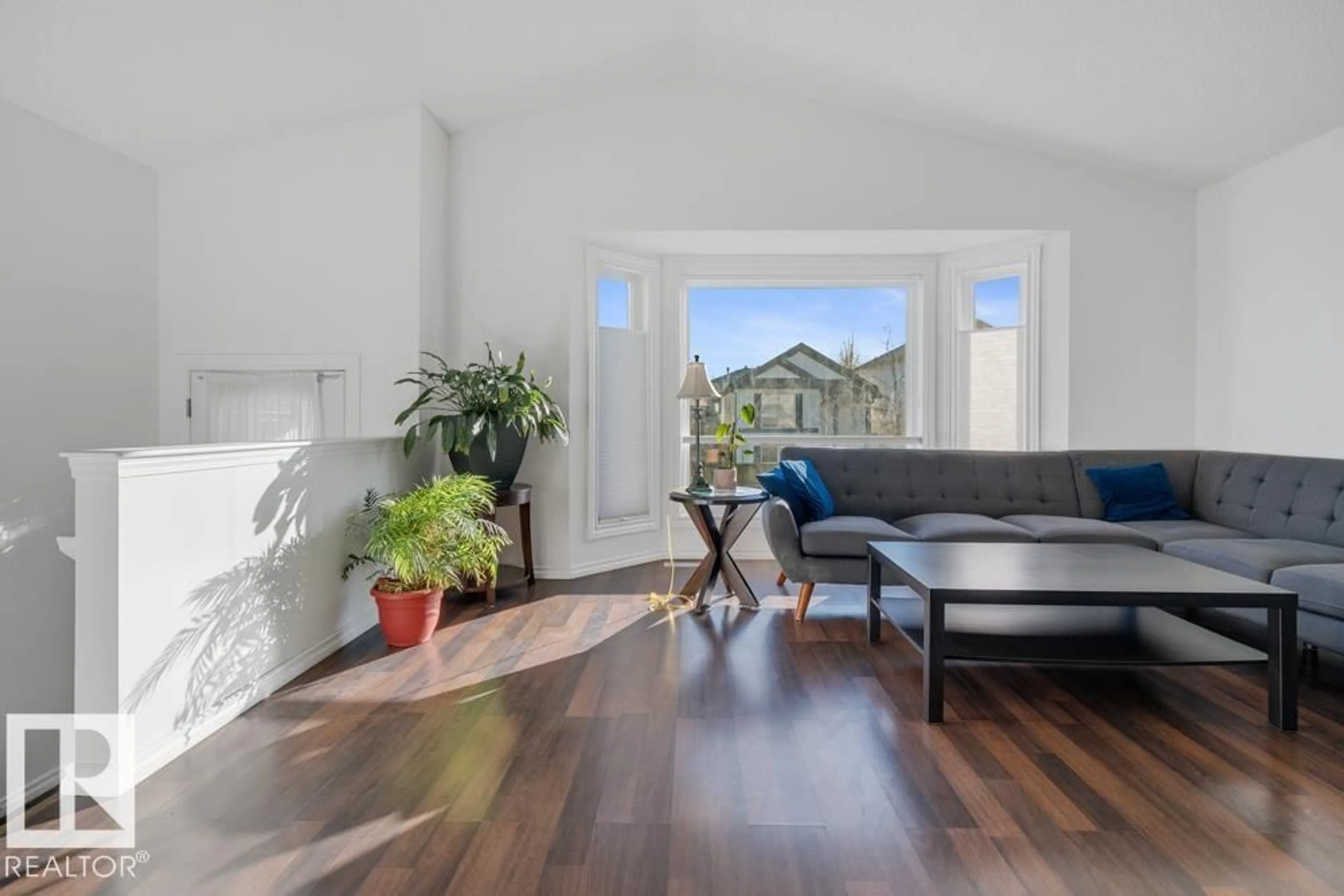 Living room with furniture, wood/laminate floor for 3020 32 AV, Edmonton Alberta T6T1X1