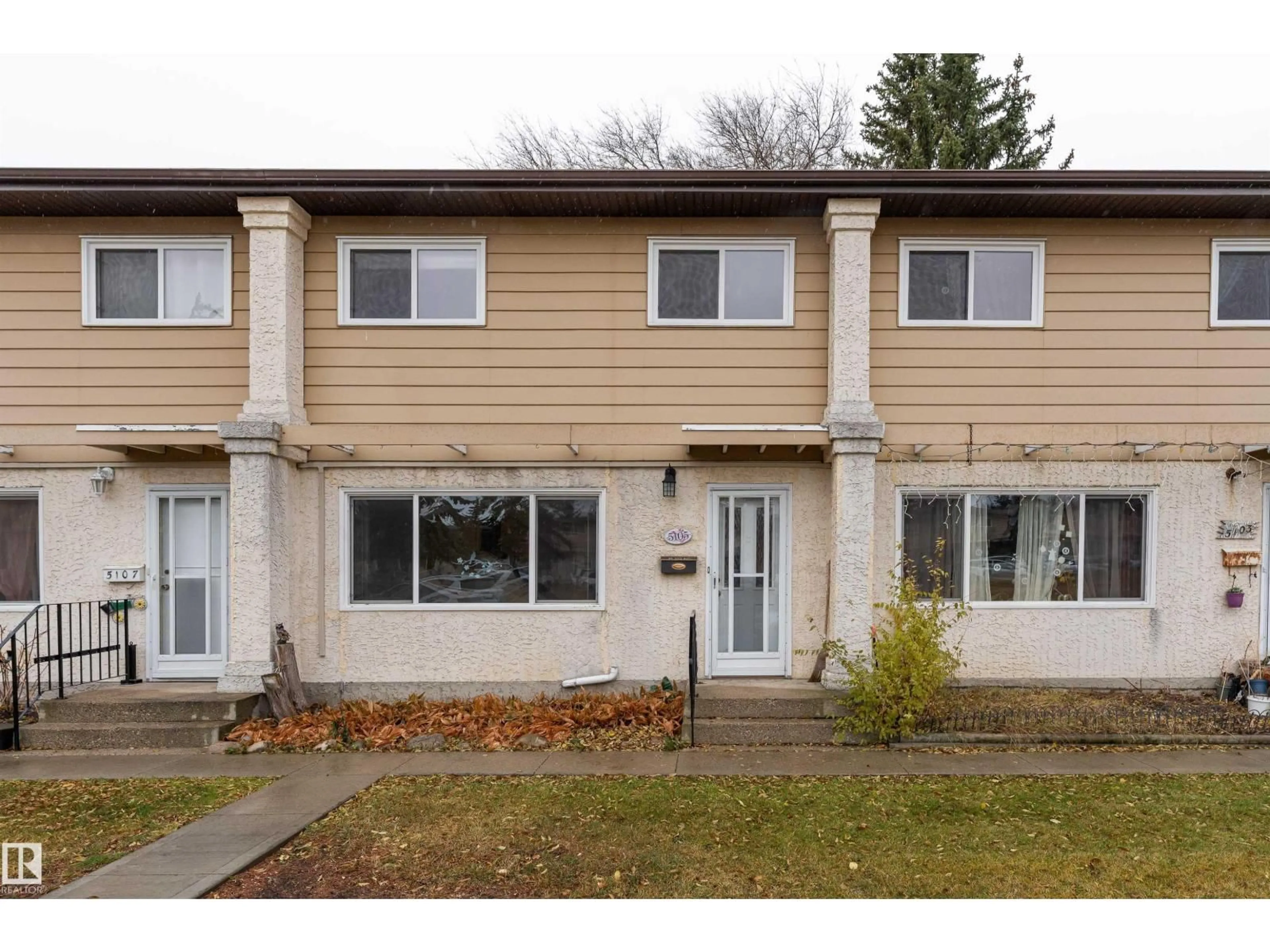 Home with vinyl exterior material, street for 5105 106A ST NW, Edmonton Alberta T6H2W6