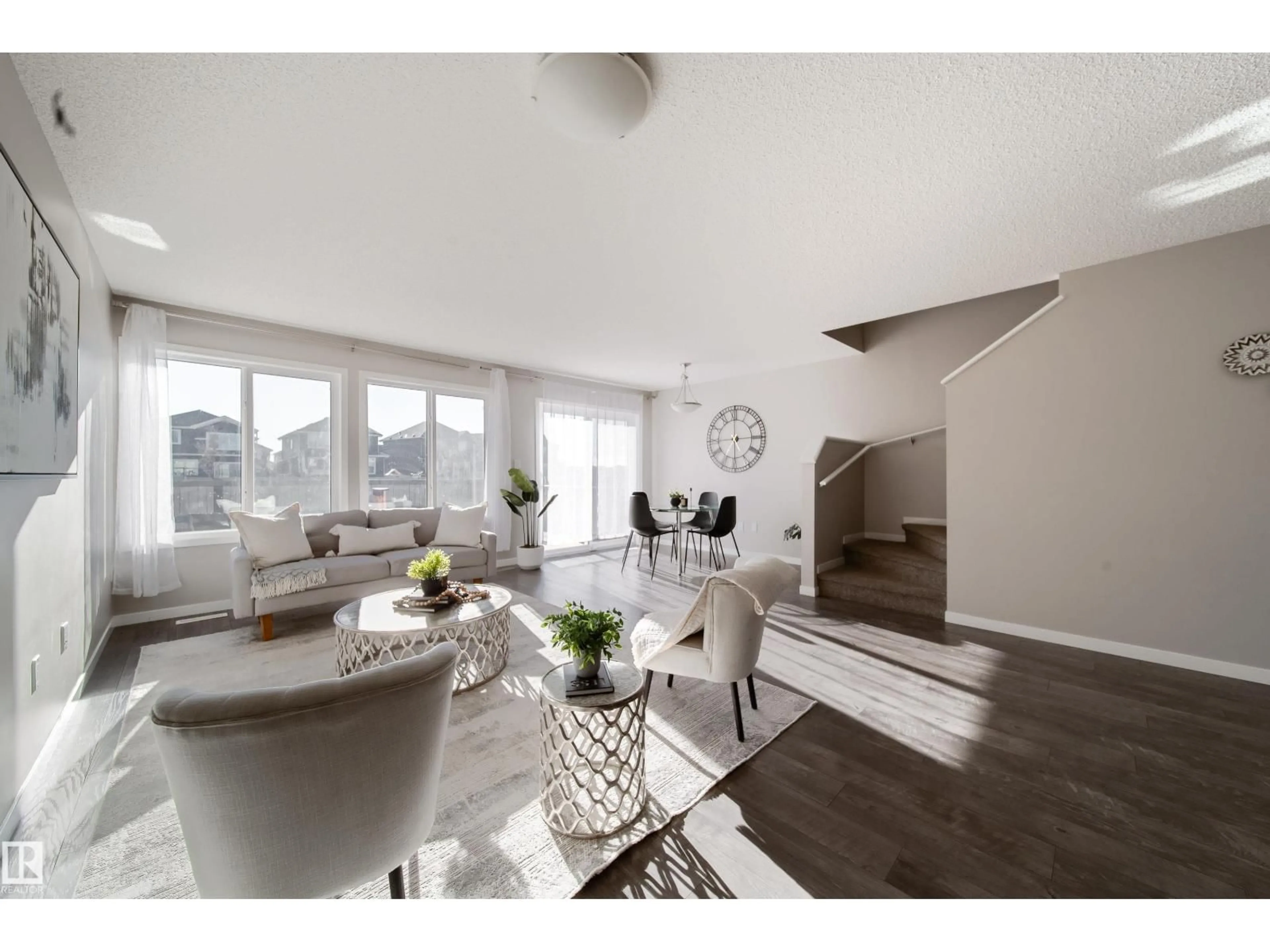 Living room with furniture, wood/laminate floor for 8409 24 AV, Edmonton Alberta T6X2G1