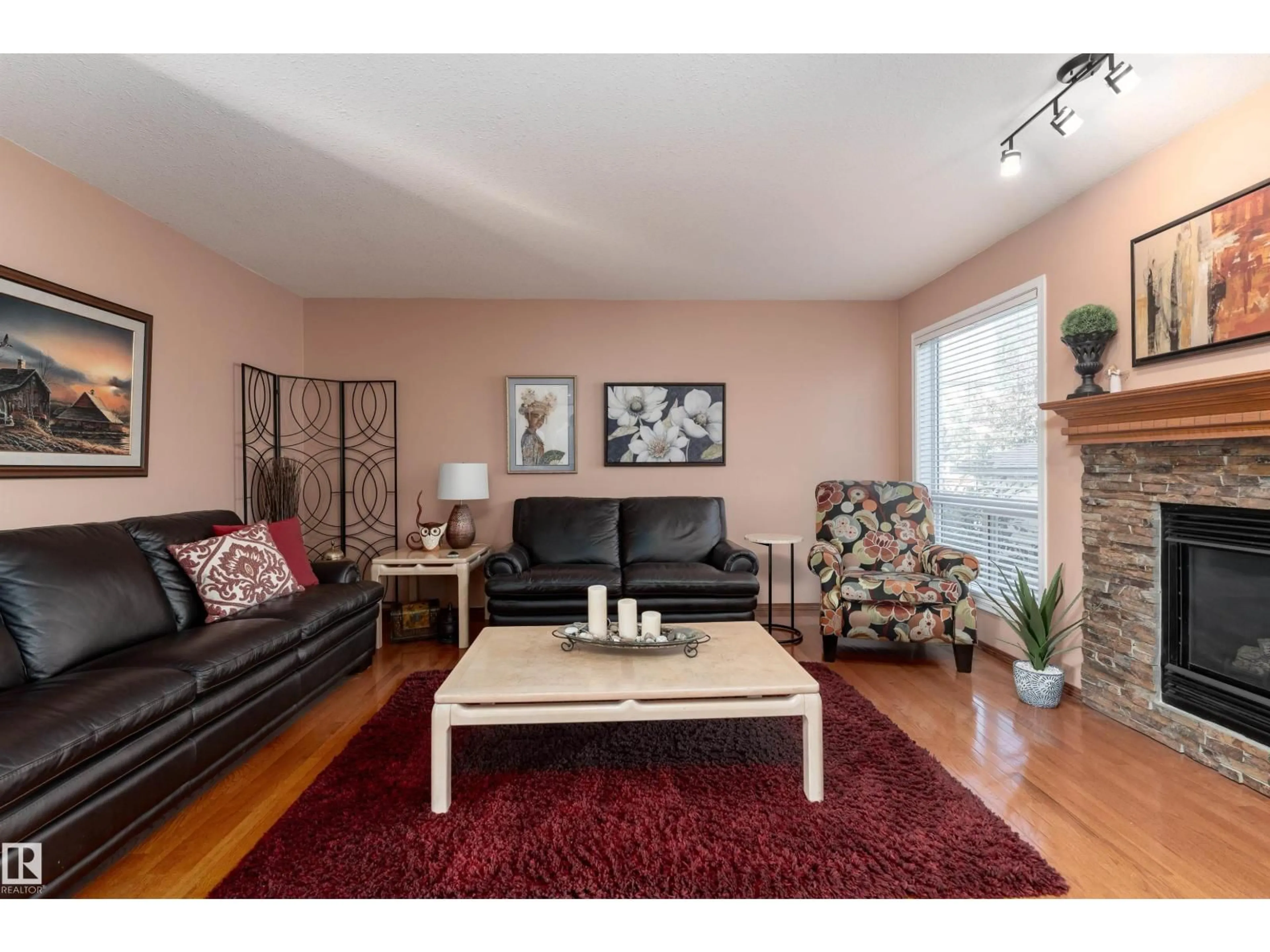 Living room with furniture, wood/laminate floor for 735 BALFOUR CL, Edmonton Alberta T5T6H7