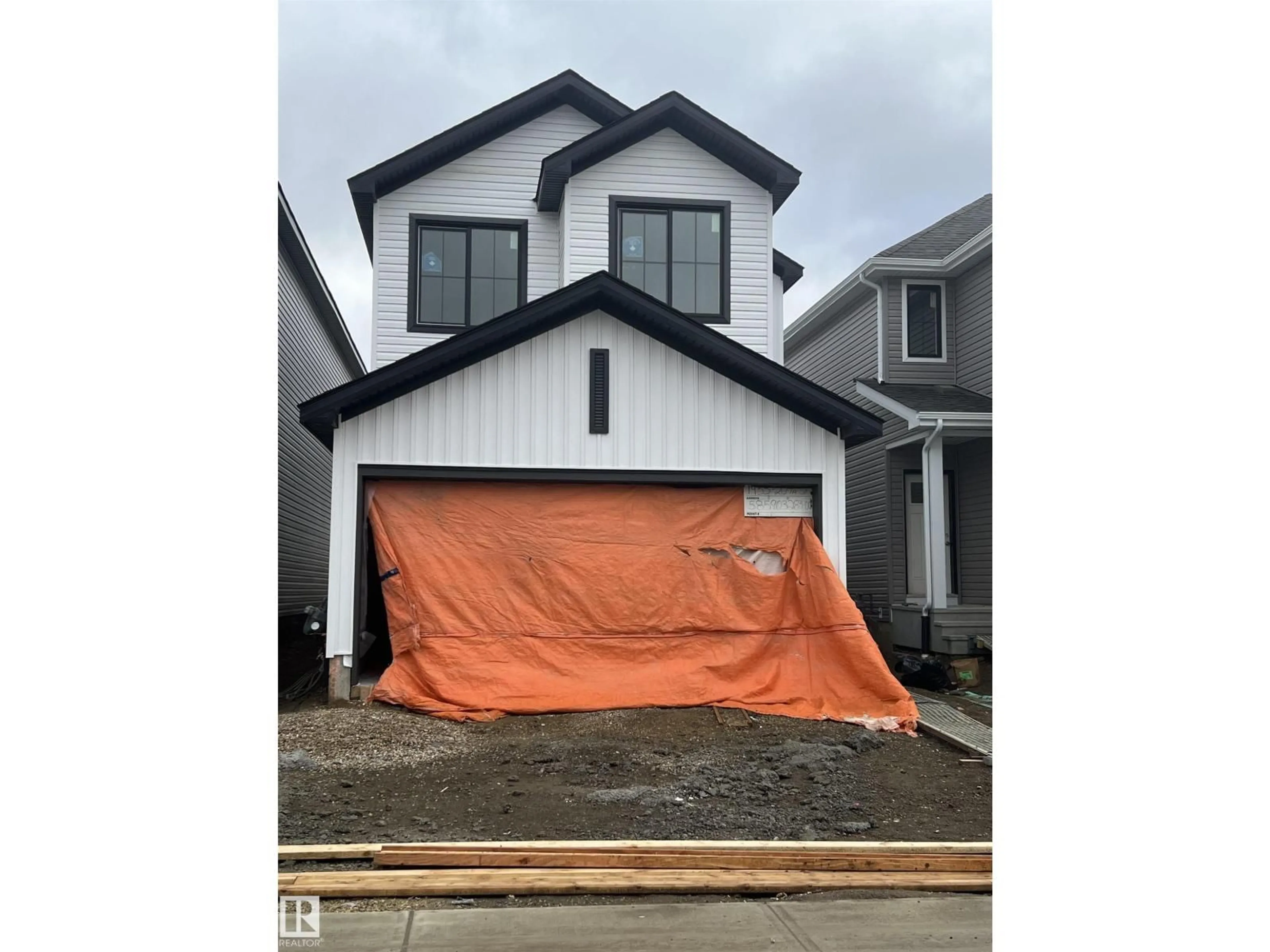 Home with vinyl exterior material, street for NW - 1953 209A ST, Edmonton Alberta T6M1P7