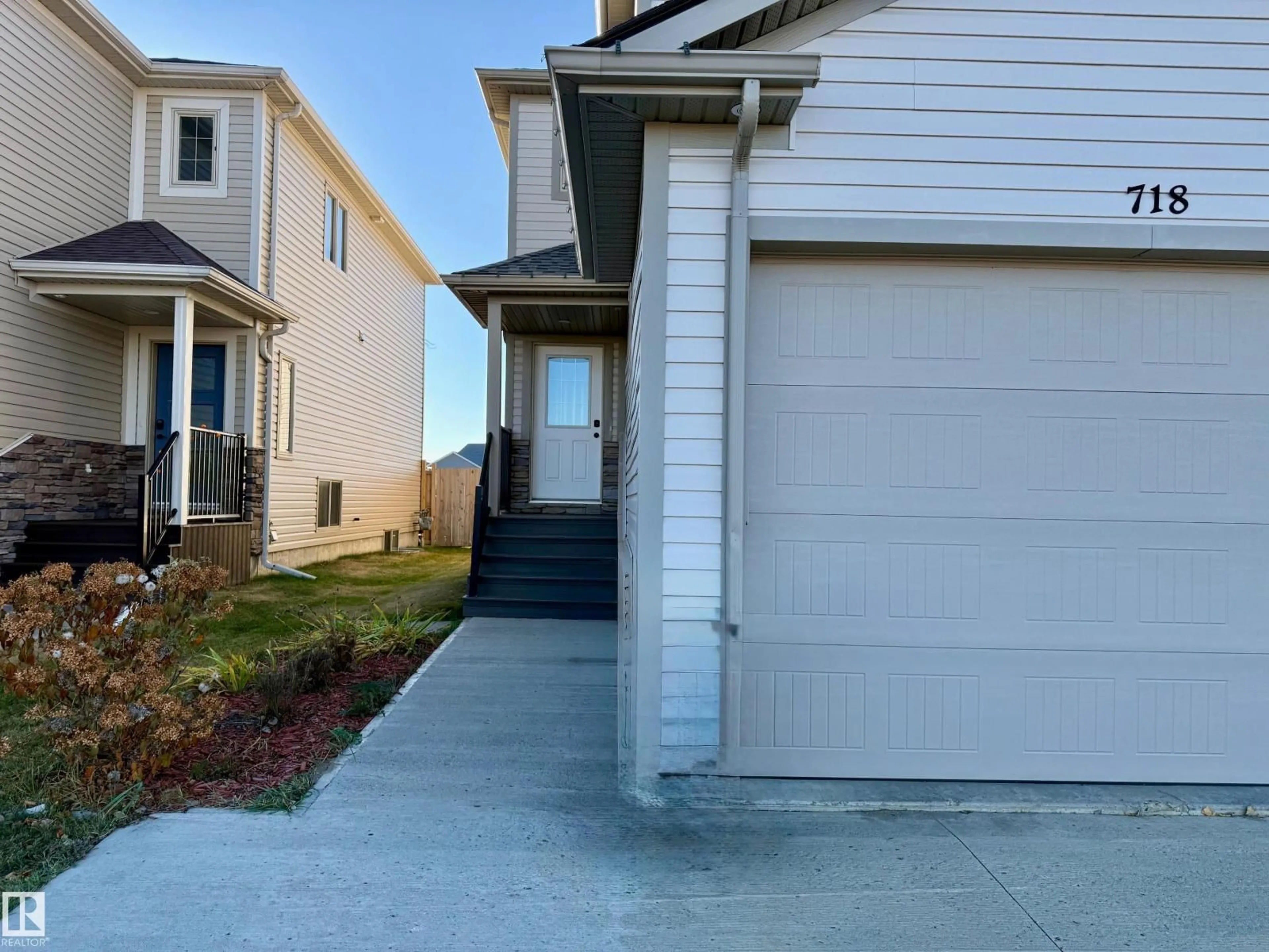 Home with vinyl exterior material, street for 718 25 ST, Wainwright Alberta T9W0B7