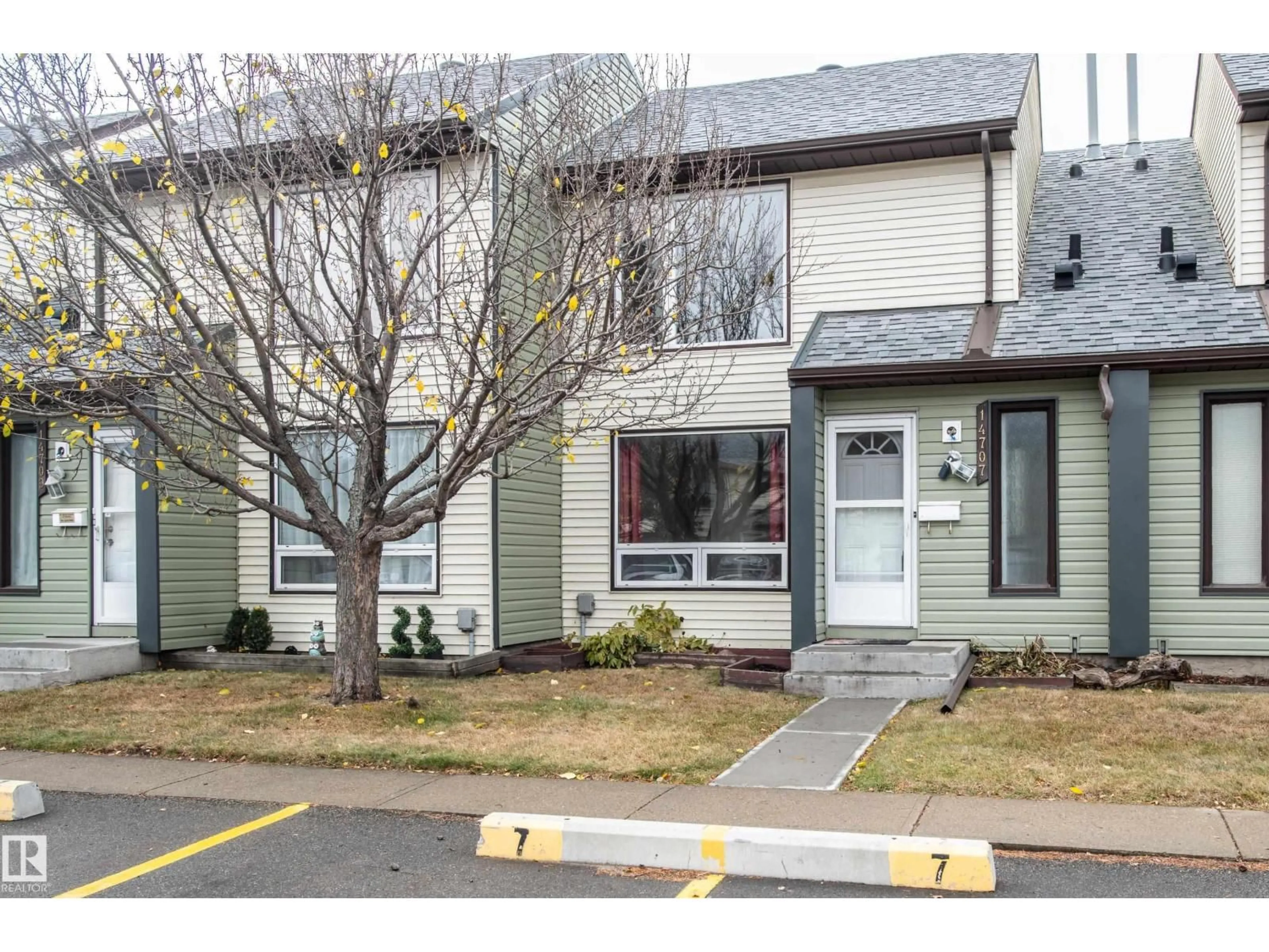 Home with vinyl exterior material, street for 14707 25 STREET, Edmonton Alberta T5Y2E8