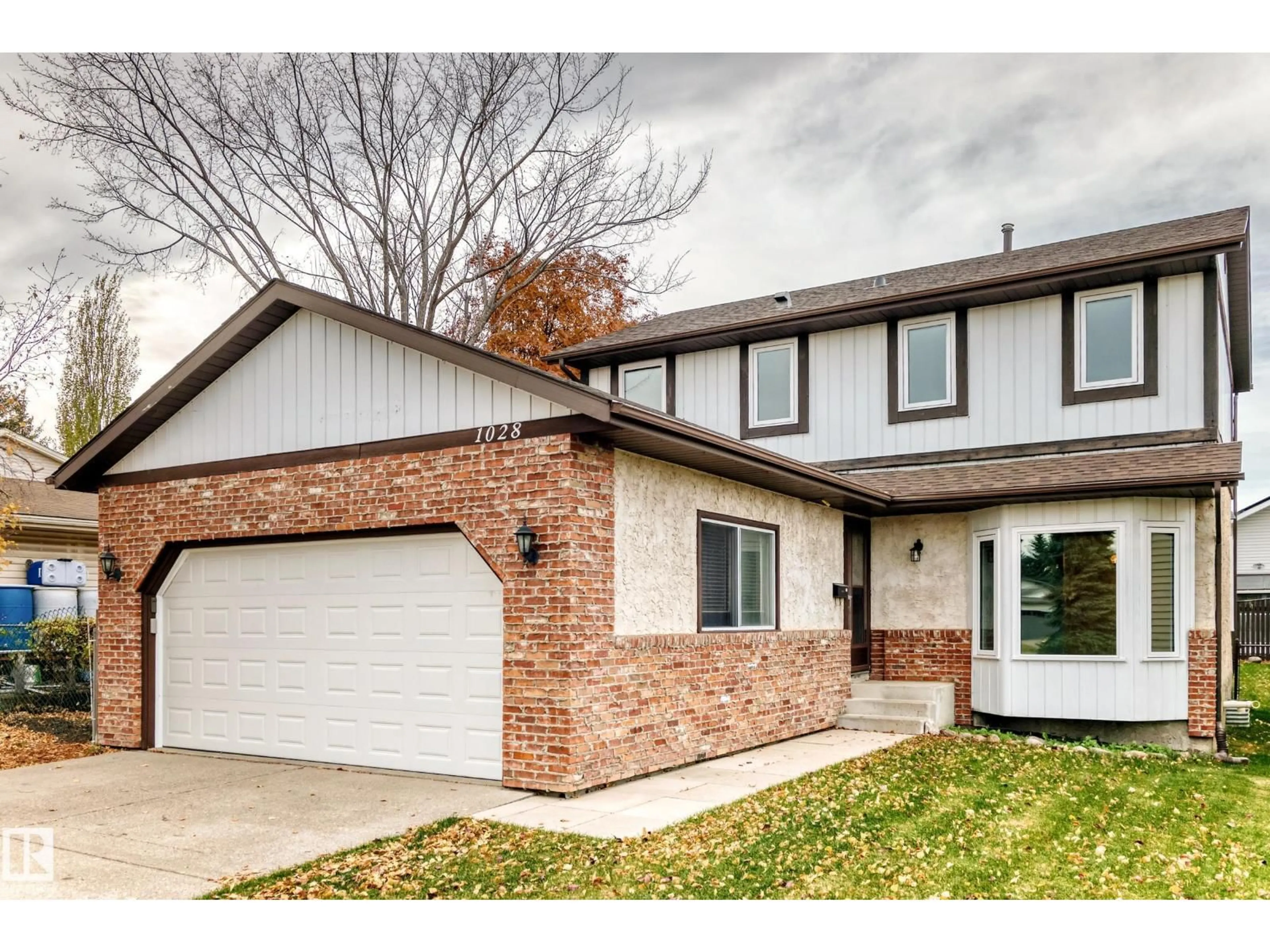 Home with brick exterior material, street for 1028 107 ST, Edmonton Alberta T6J6H2