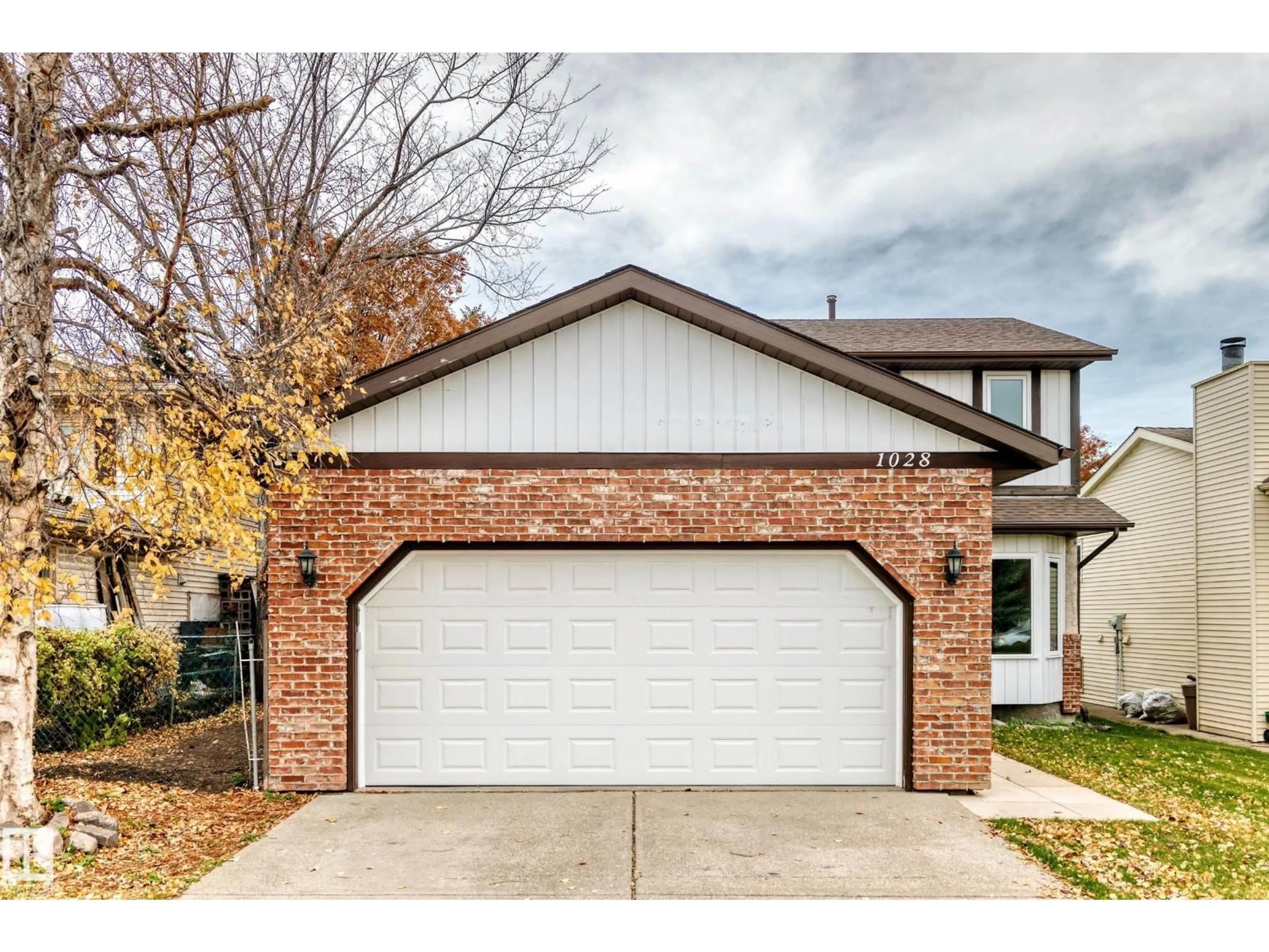 Home with brick exterior material, street for 1028 107 ST, Edmonton Alberta T6J6H2